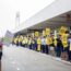 a group of people holding signs