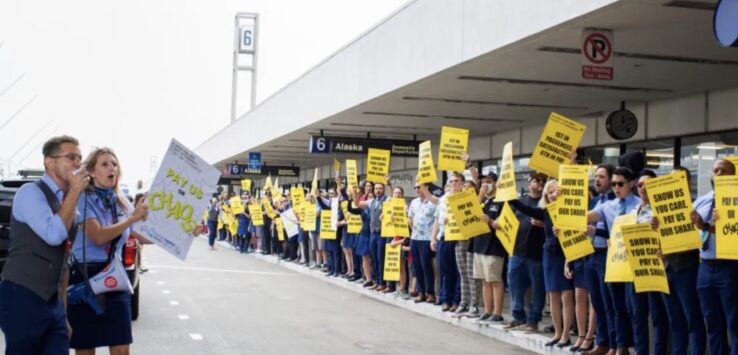 a group of people holding signs