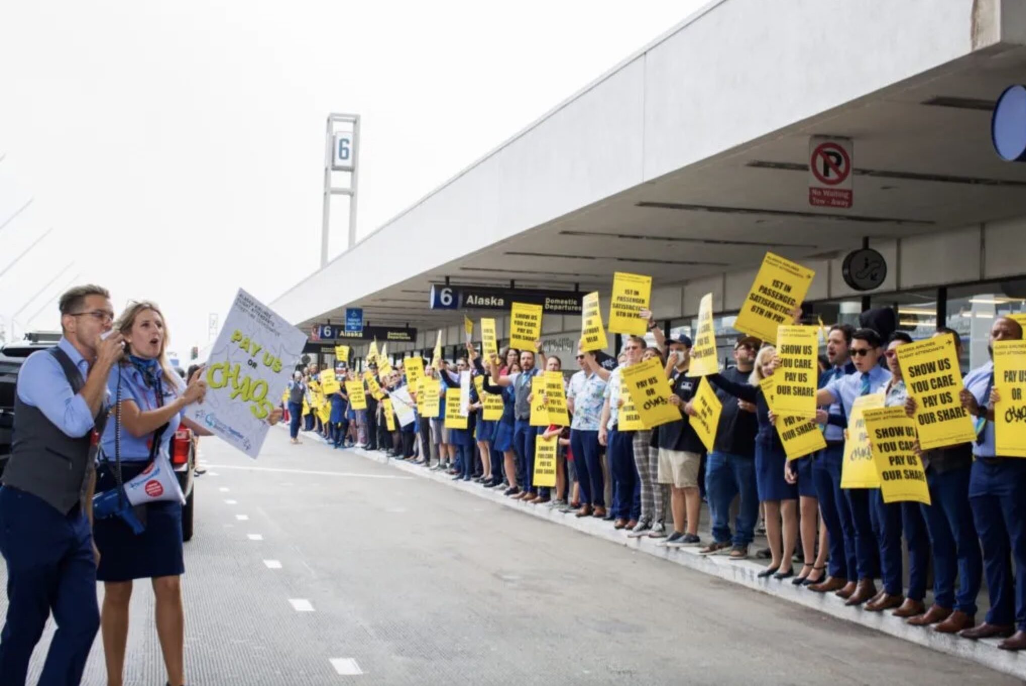 a group of people holding signs