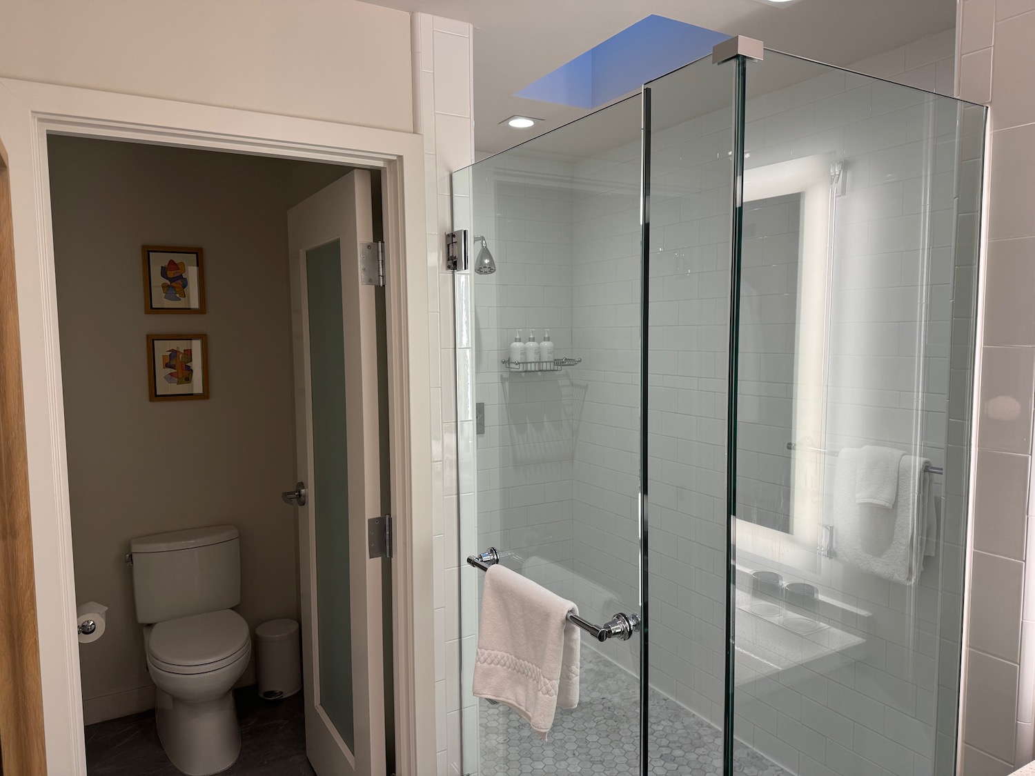 a bathroom with a glass shower door