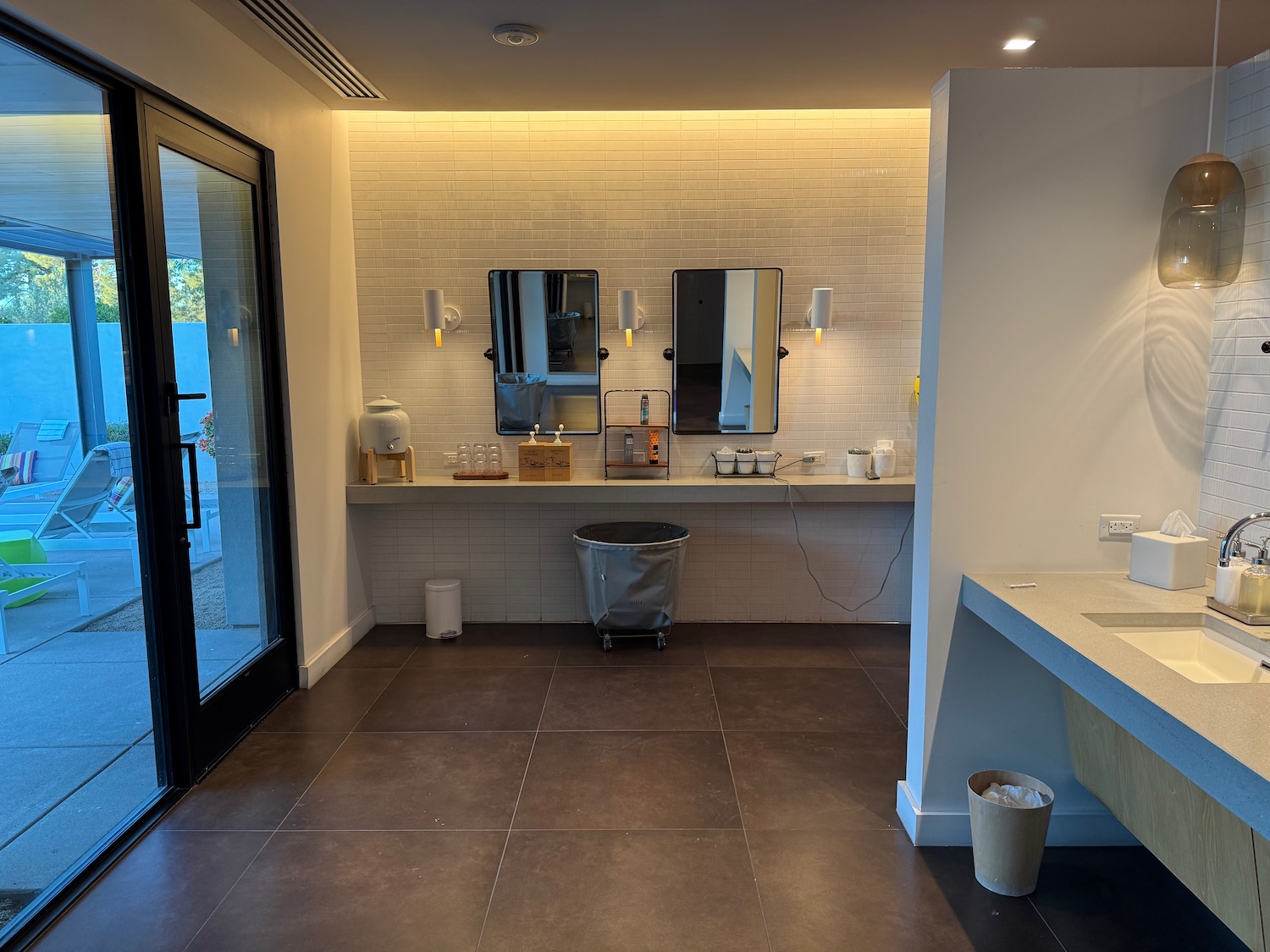 a bathroom with a sink and mirrors