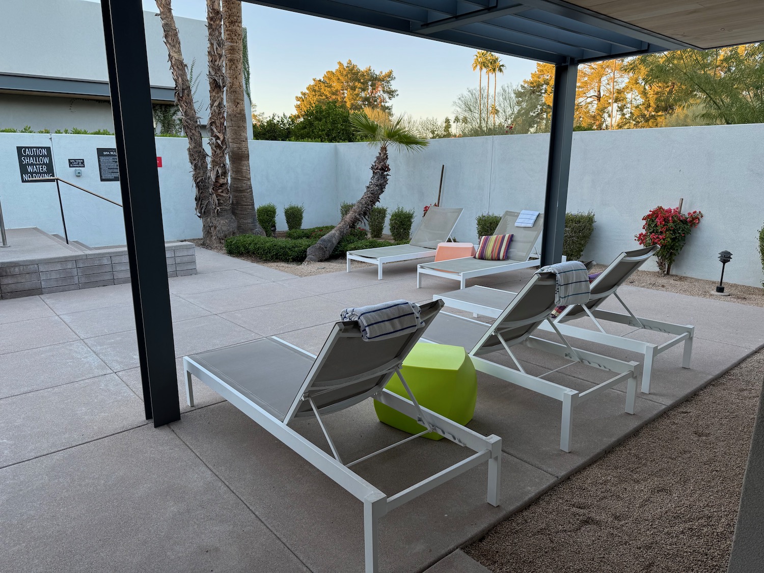 a group of lounge chairs on a patio