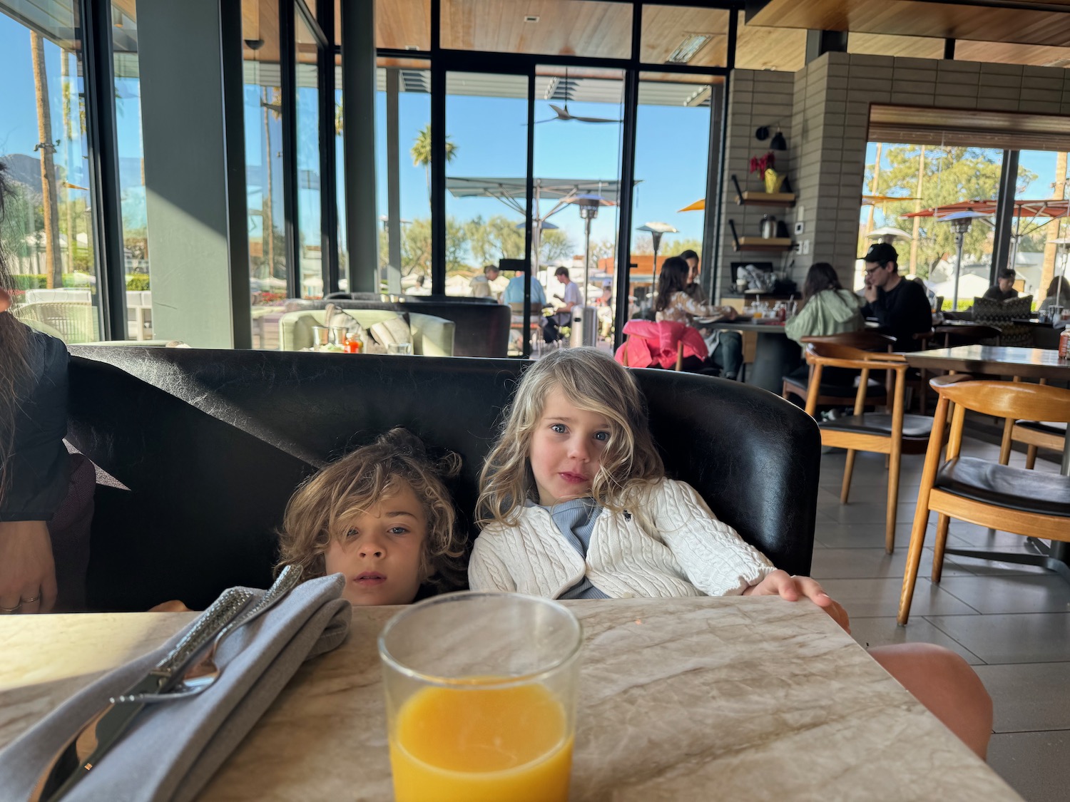 a two children sitting at a table