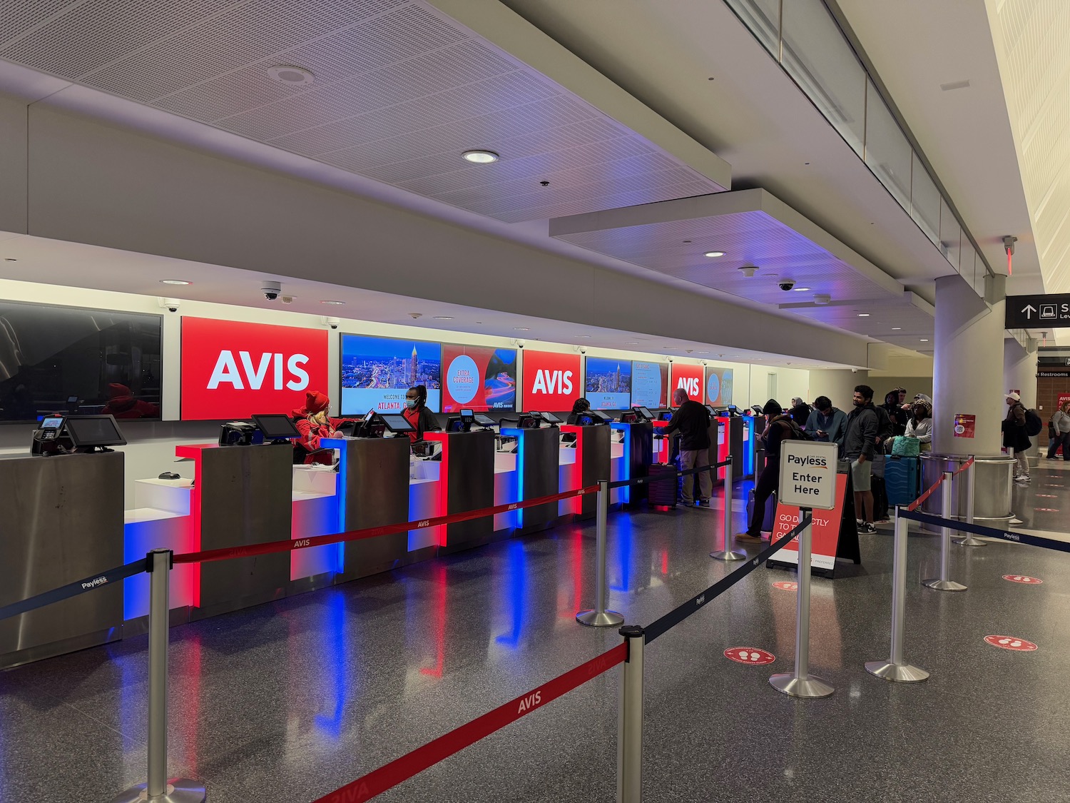 people standing in line at a counter