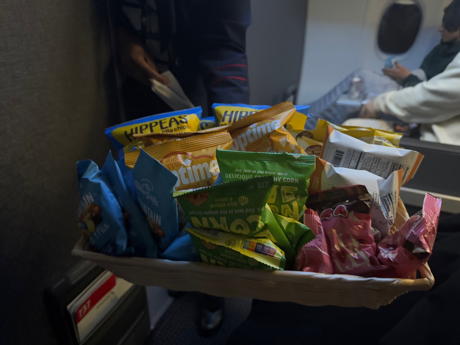 a basket of snacks on an airplane