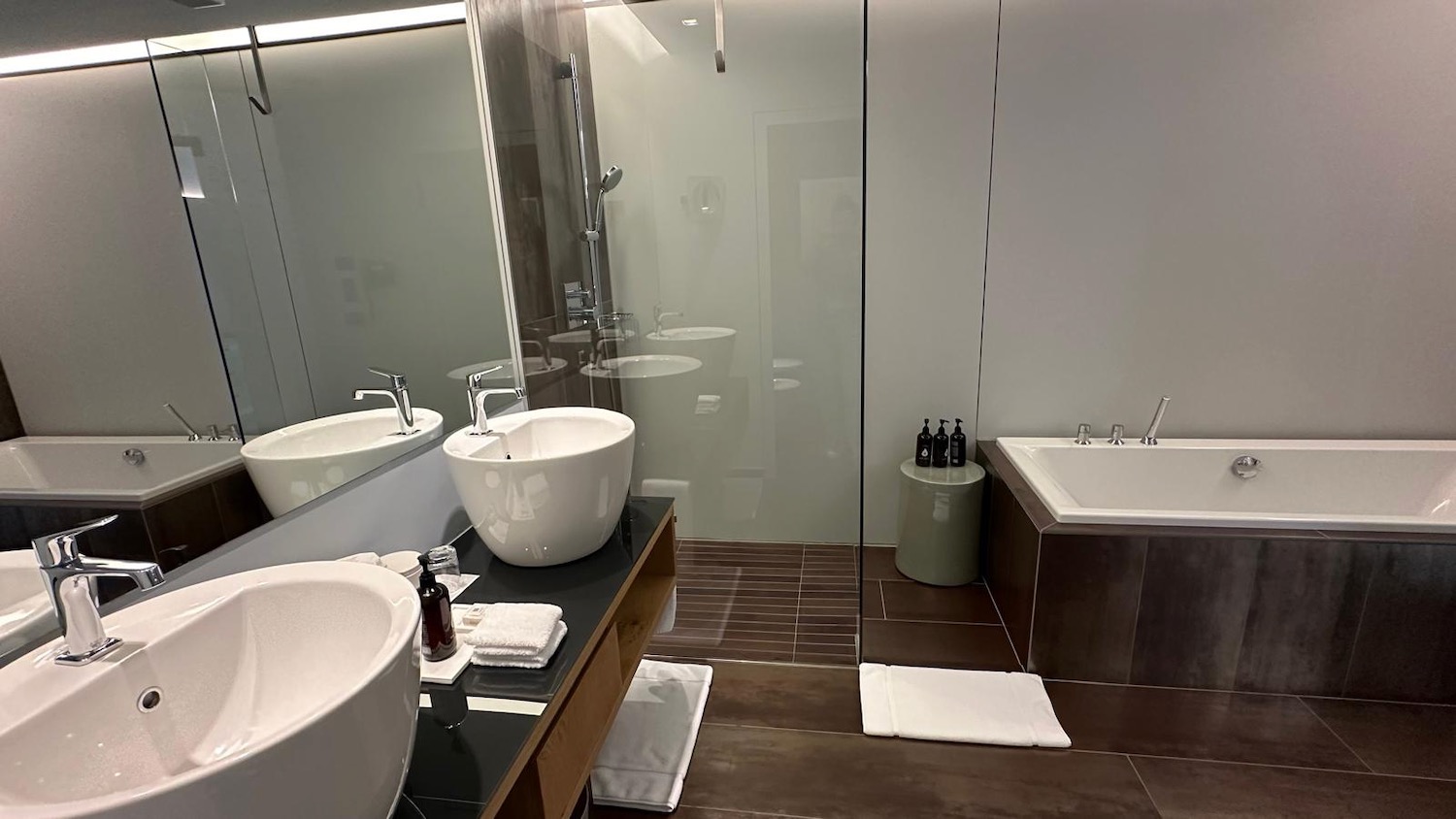 a bathroom with a glass shower door