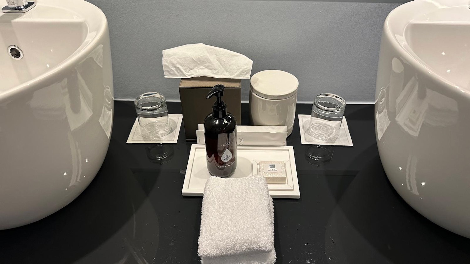 a bathroom set up with a towel and soap