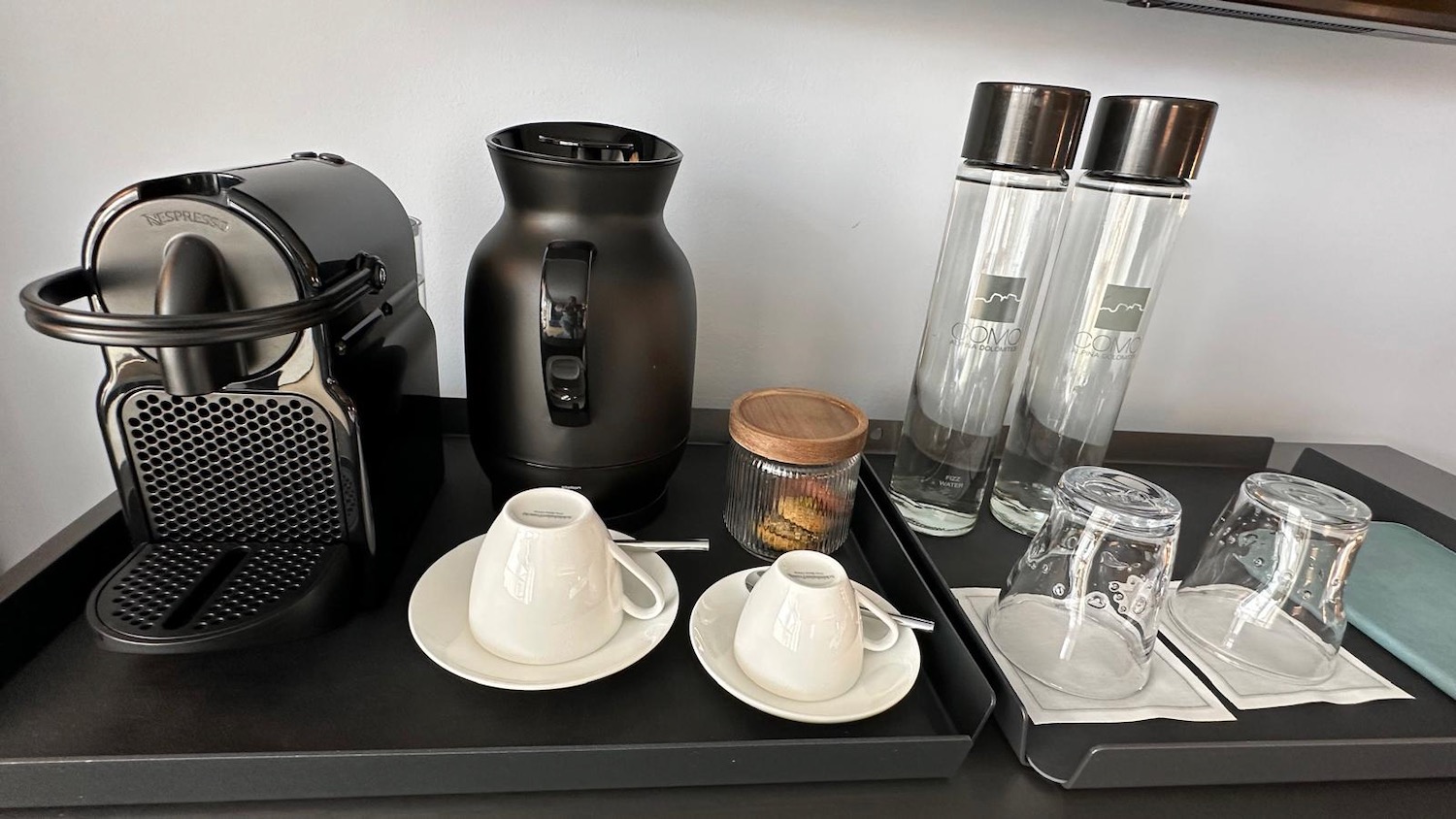 a tray with cups and saucers on it