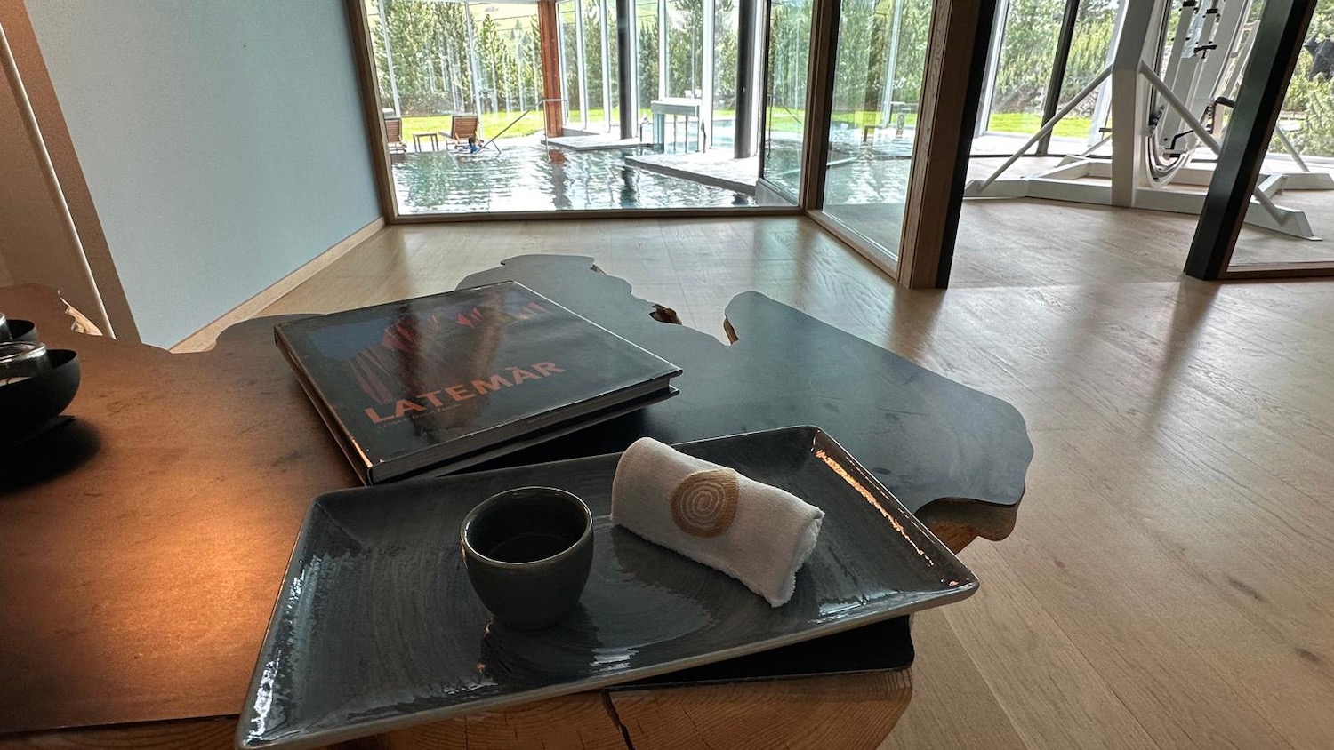 a table with a book and a cup on it