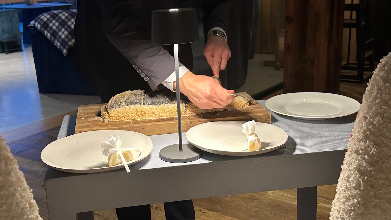 a person cutting food on a table