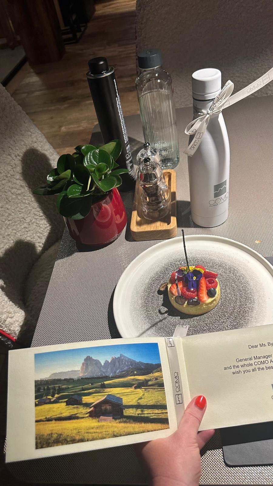 a plate with food on it next to a book