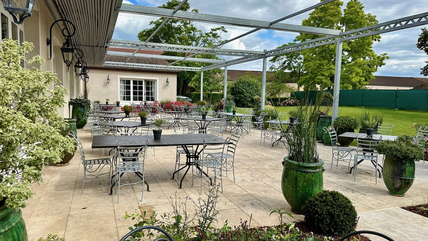 a patio with tables and chairs