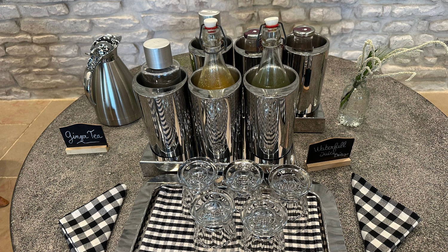 a group of glasses and bottles on a table