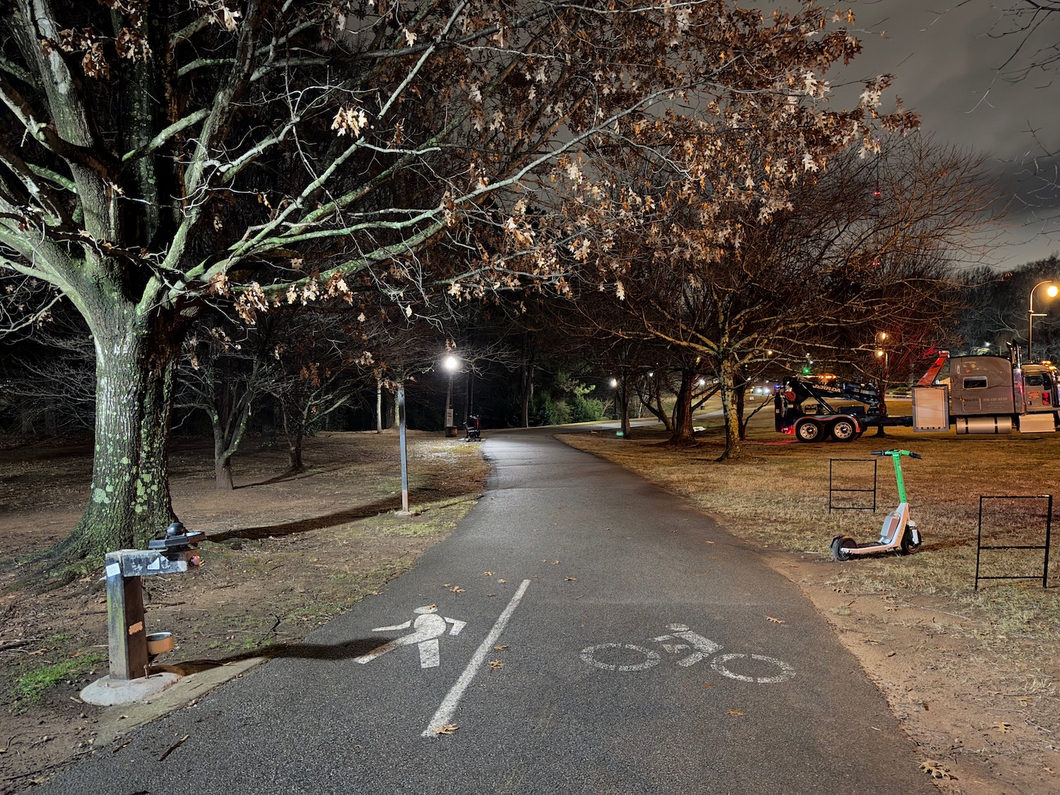 a path with a bike and a person walking on it