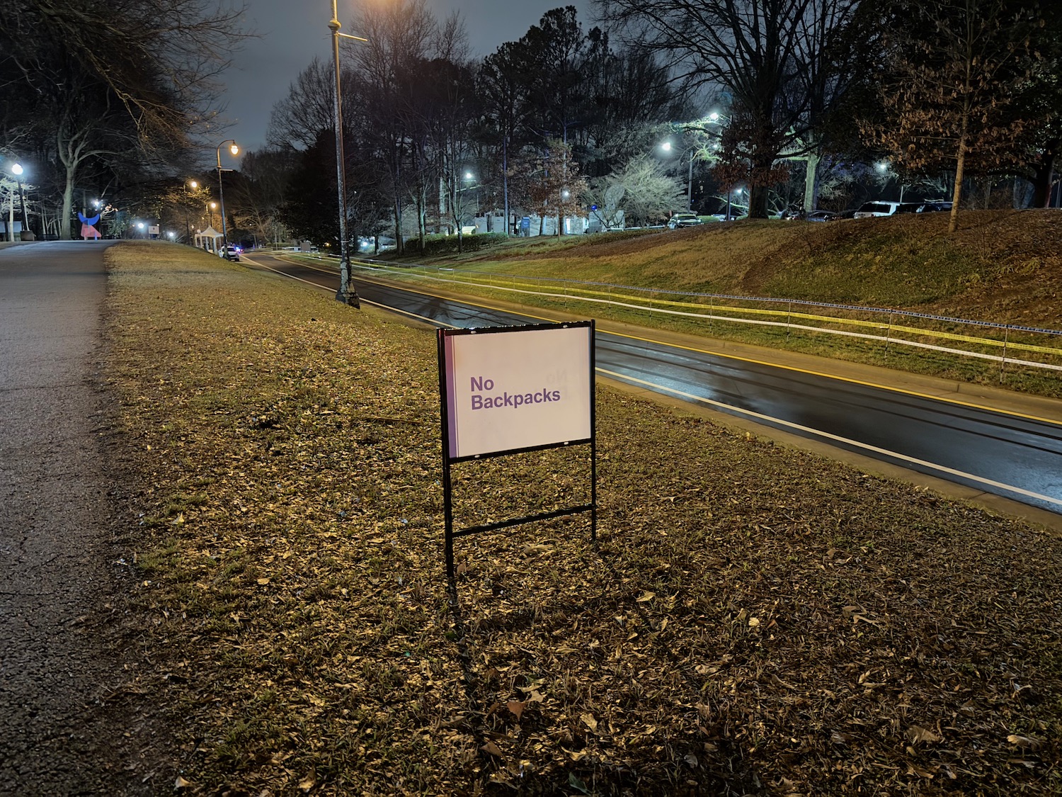 a sign on a grass field