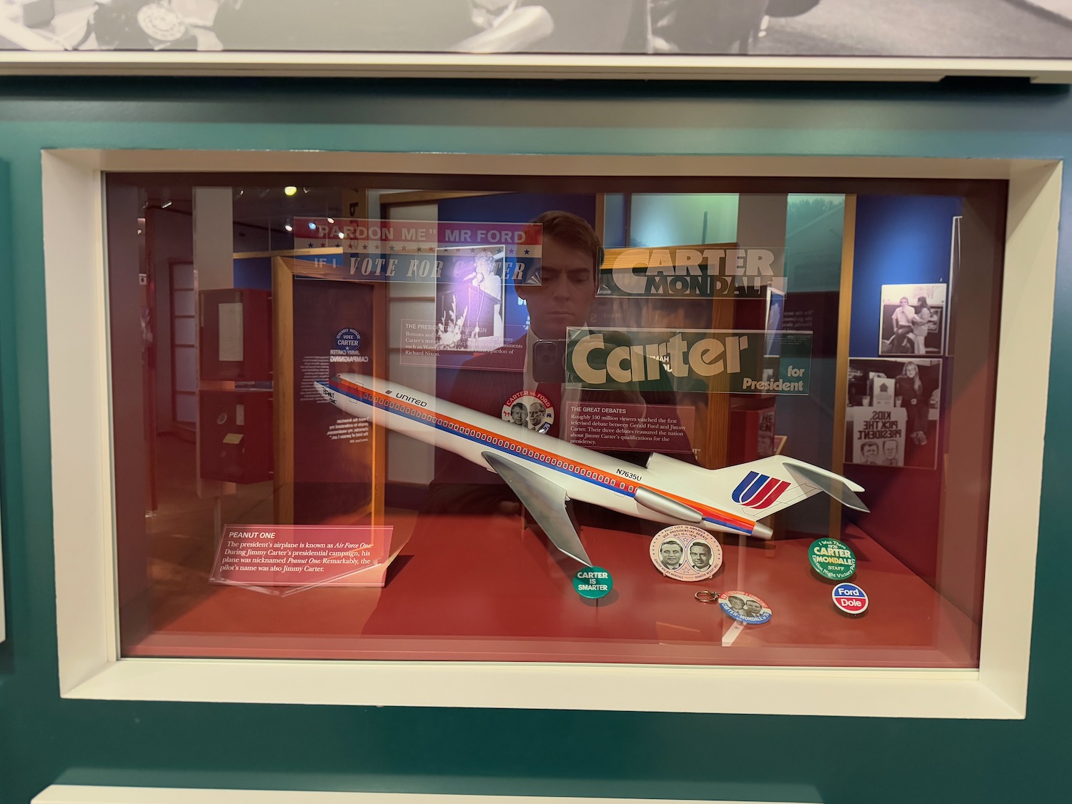 a model airplane in a glass case