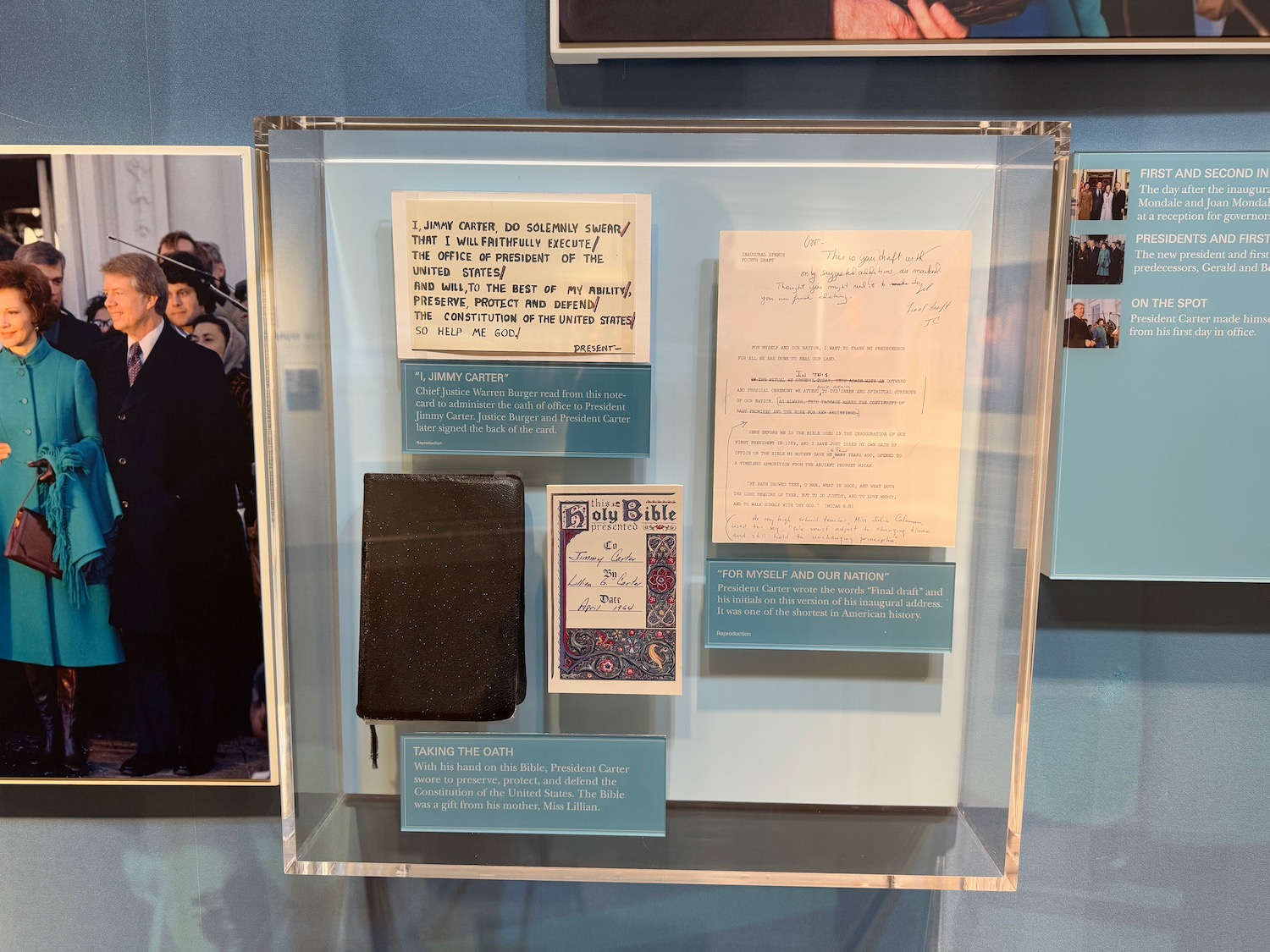 a display case with papers and pictures