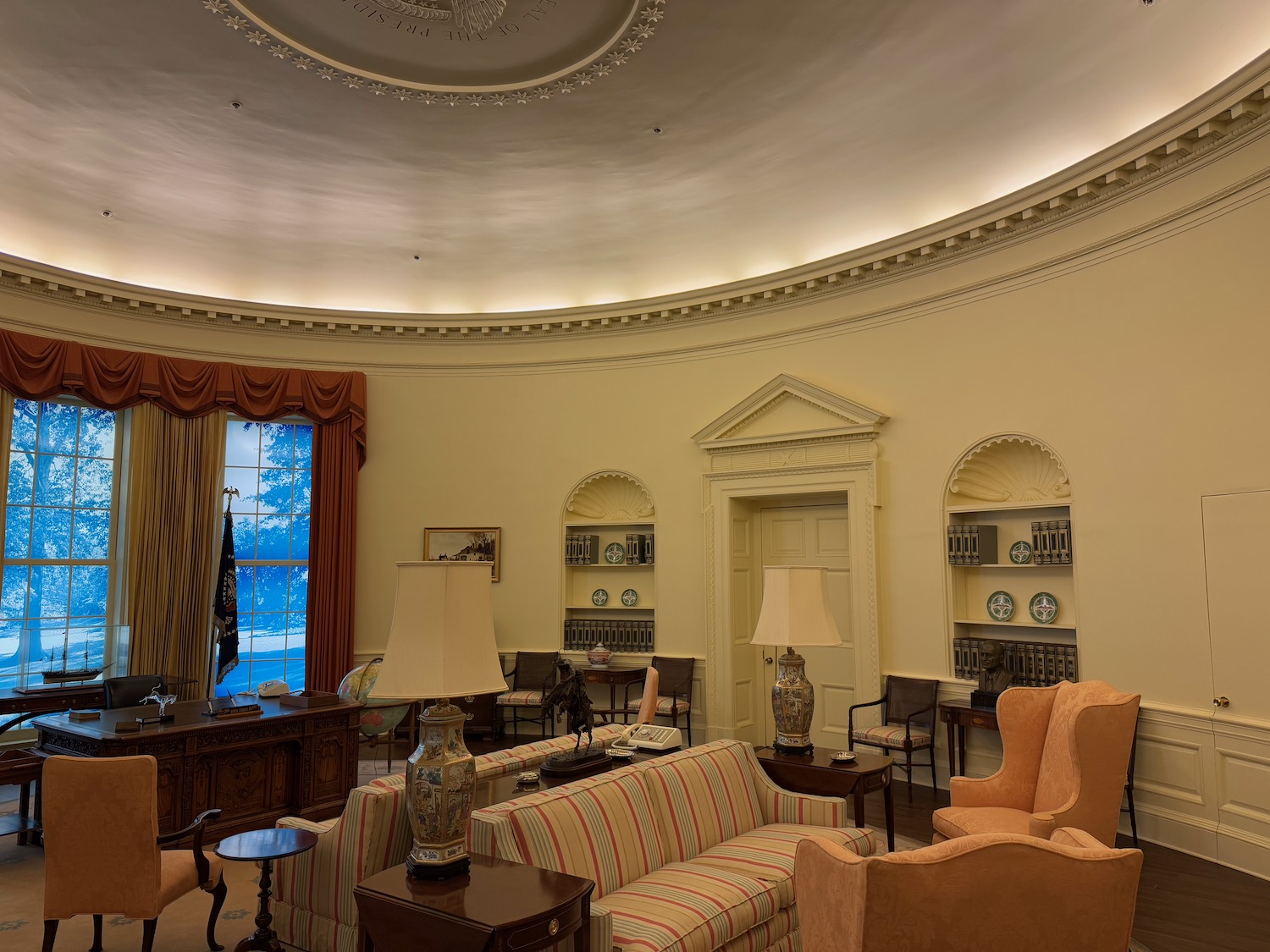 a room with a round ceiling and a large window