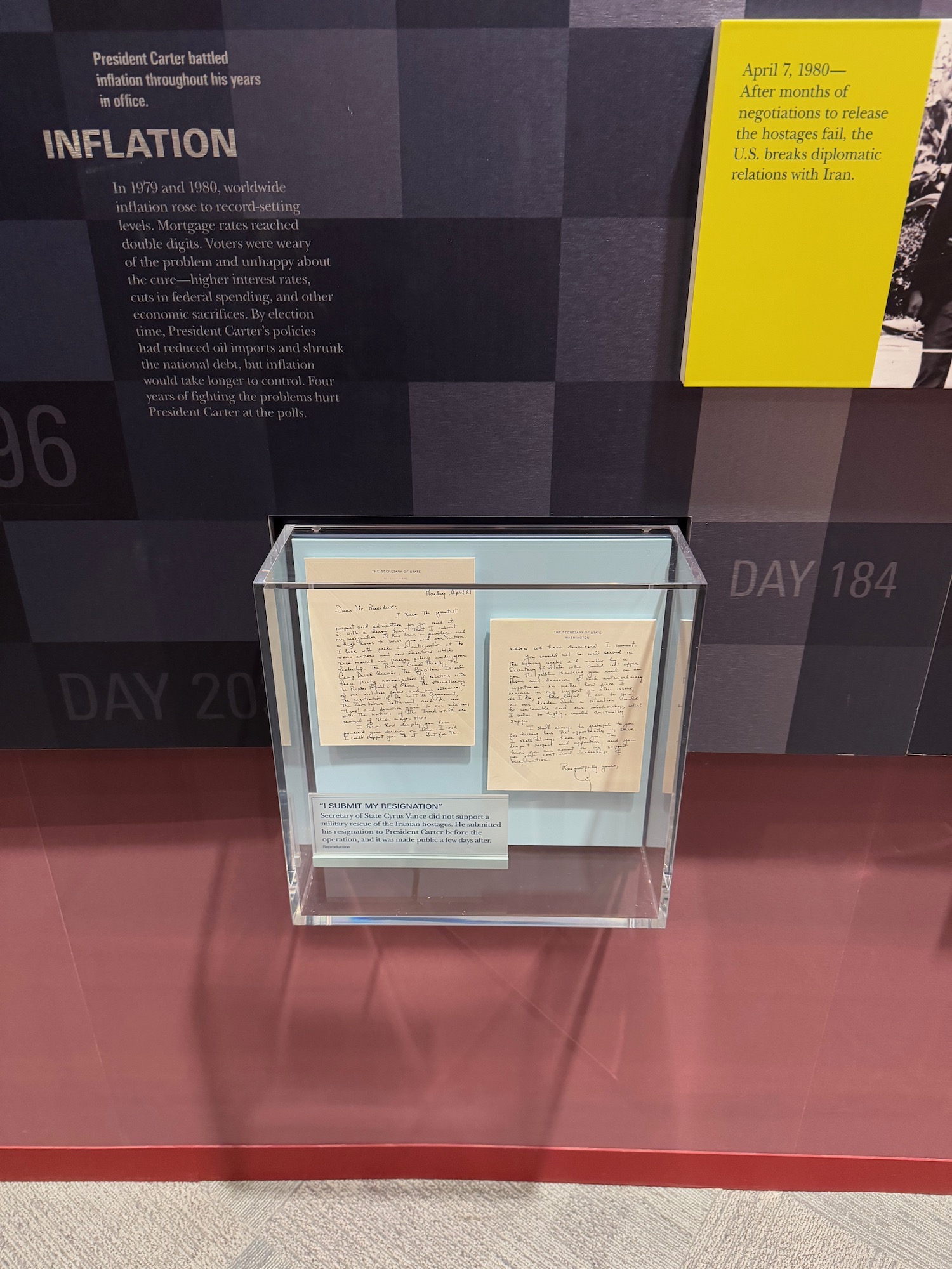 a glass box with papers and notes