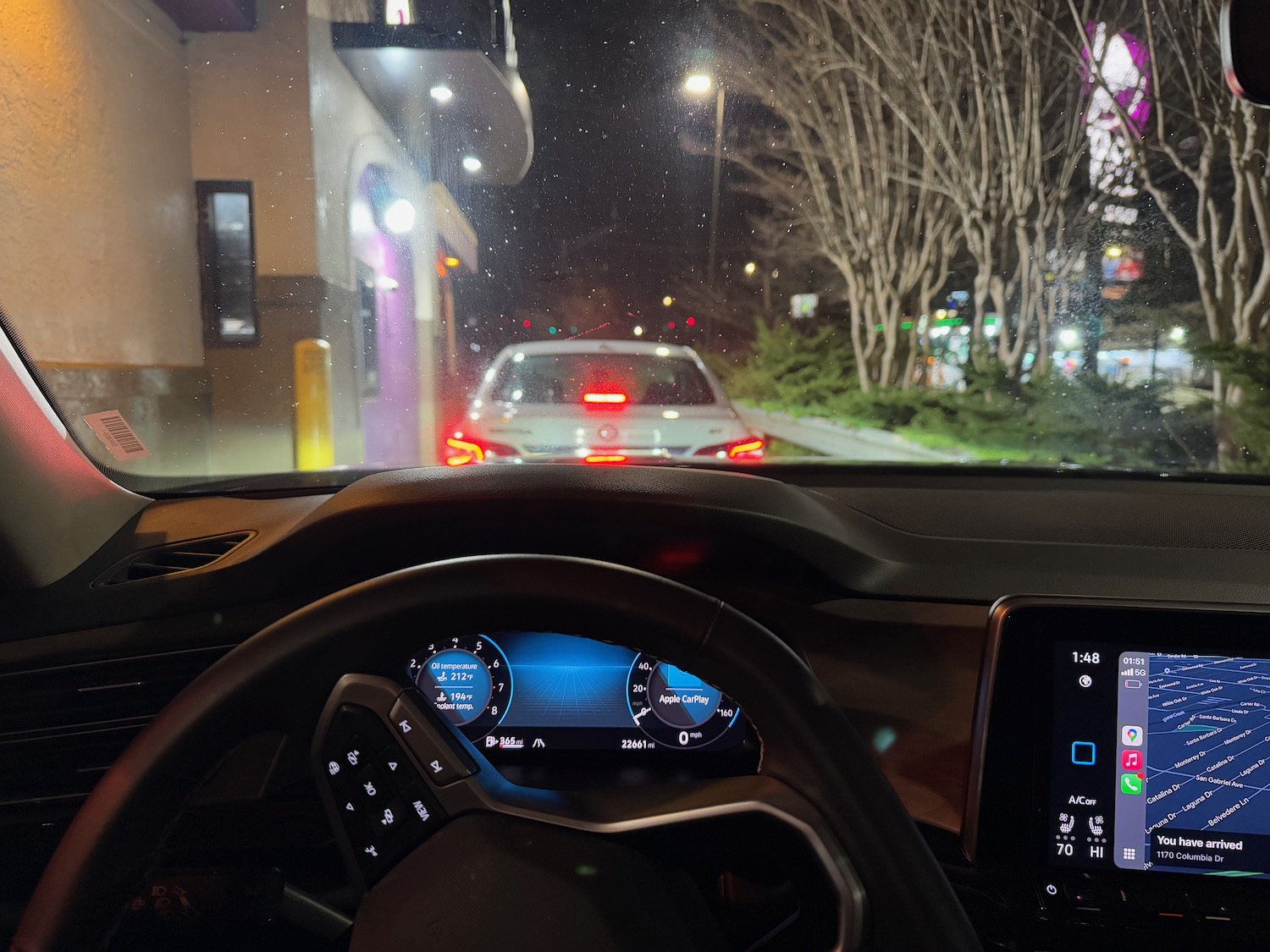 a car driving on a street at night