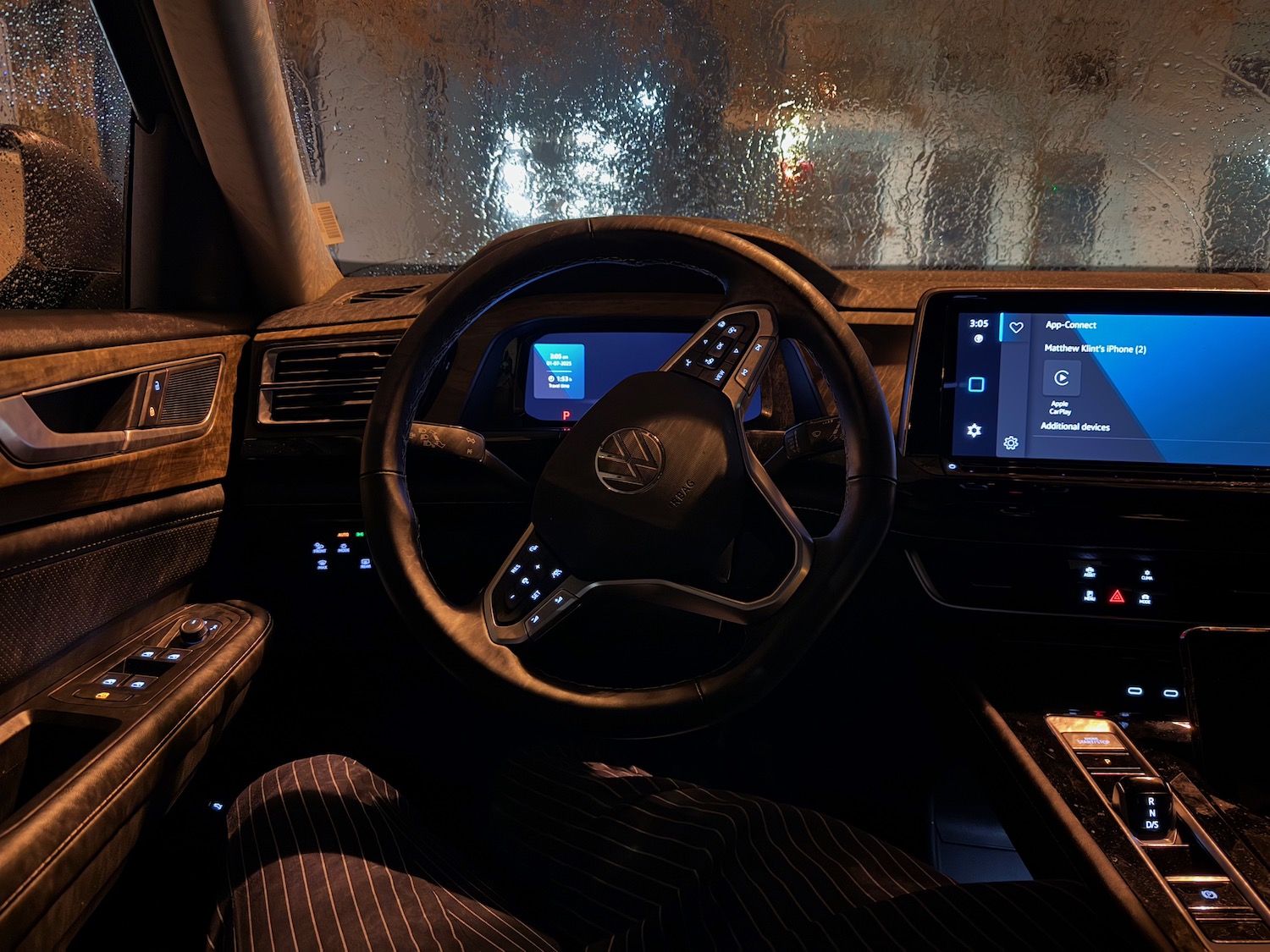 inside a car with a steering wheel and dashboard