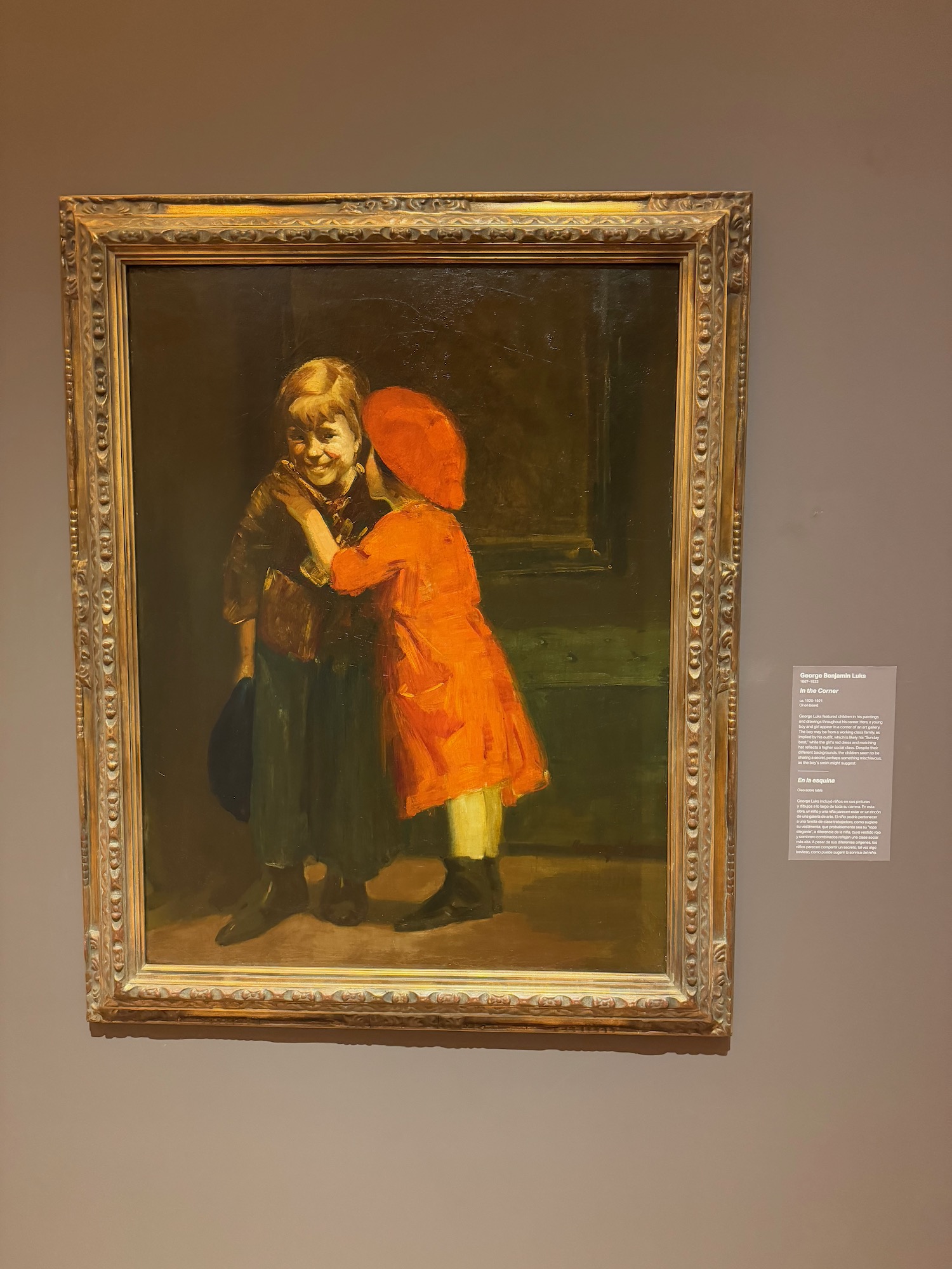 a painting of two children in a frame