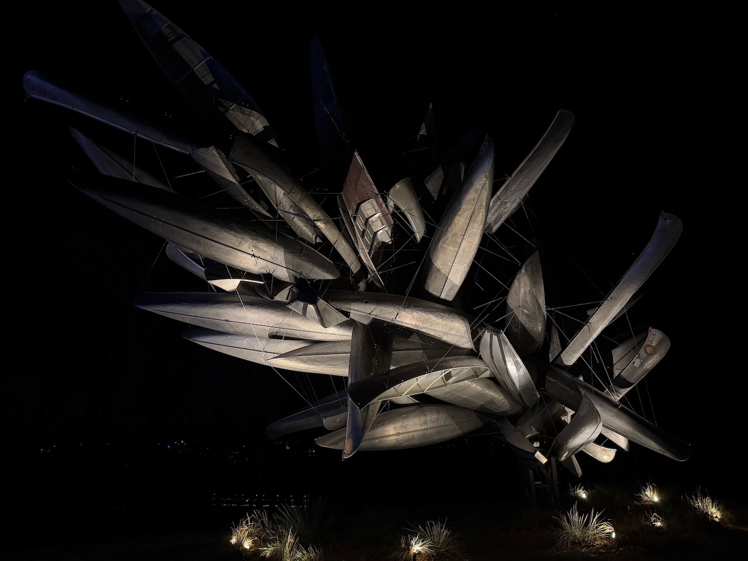 a sculpture of boats at night