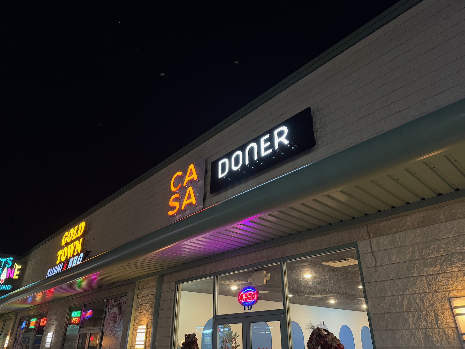 a building with neon signs