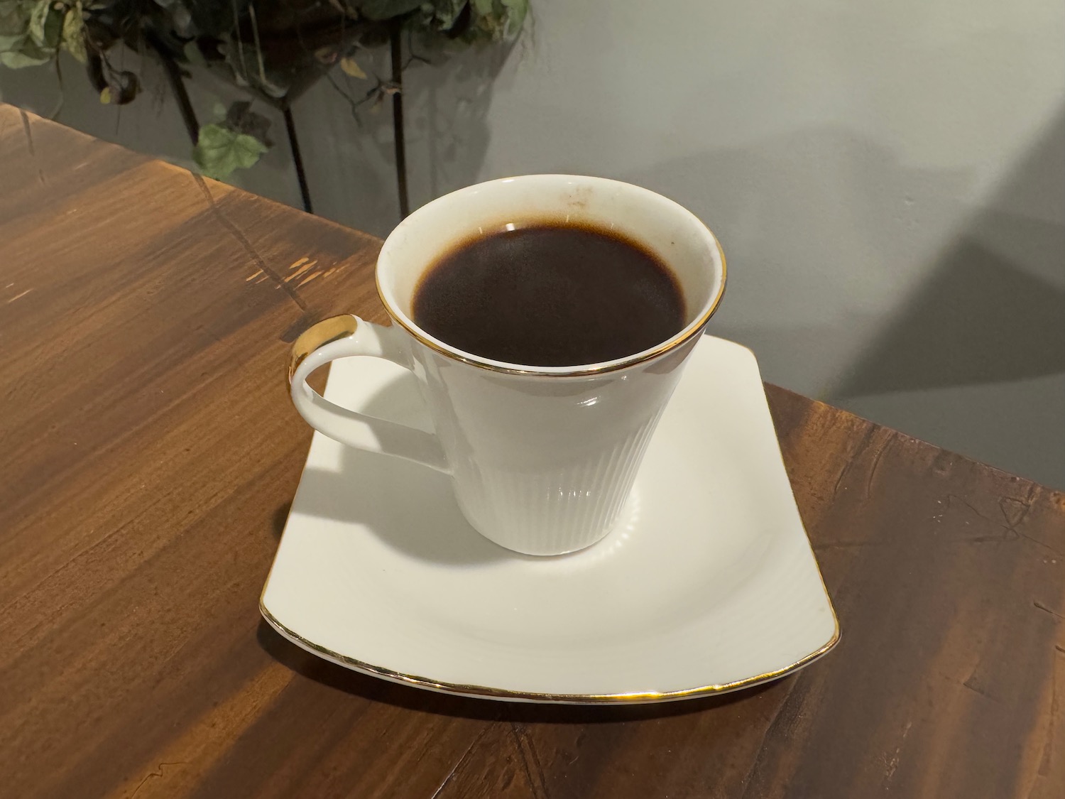 a cup of coffee on a plate