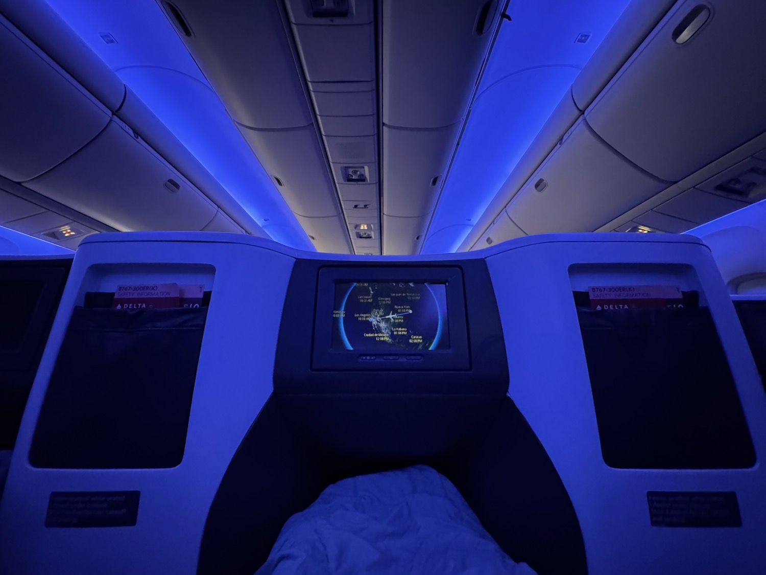 a seat with a screen and a blue light