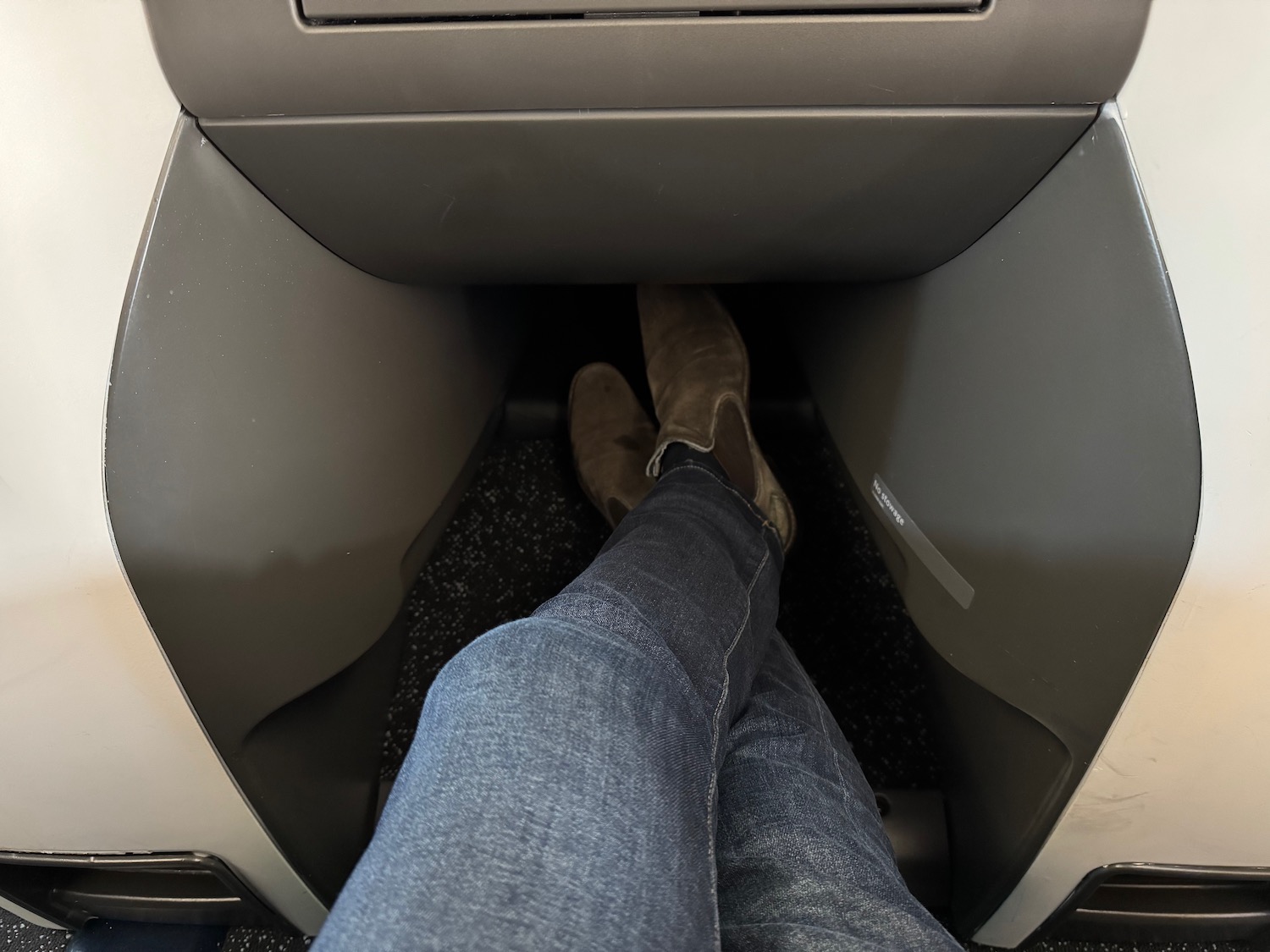 a person's legs in a seat