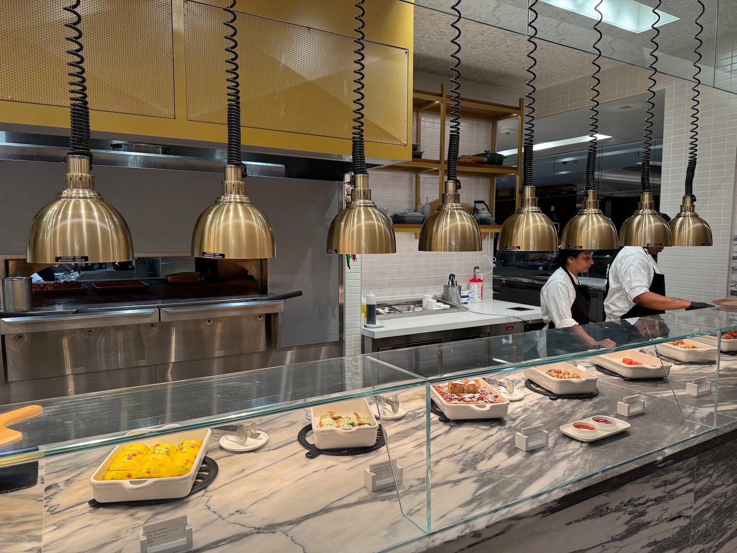 a group of people in a kitchen