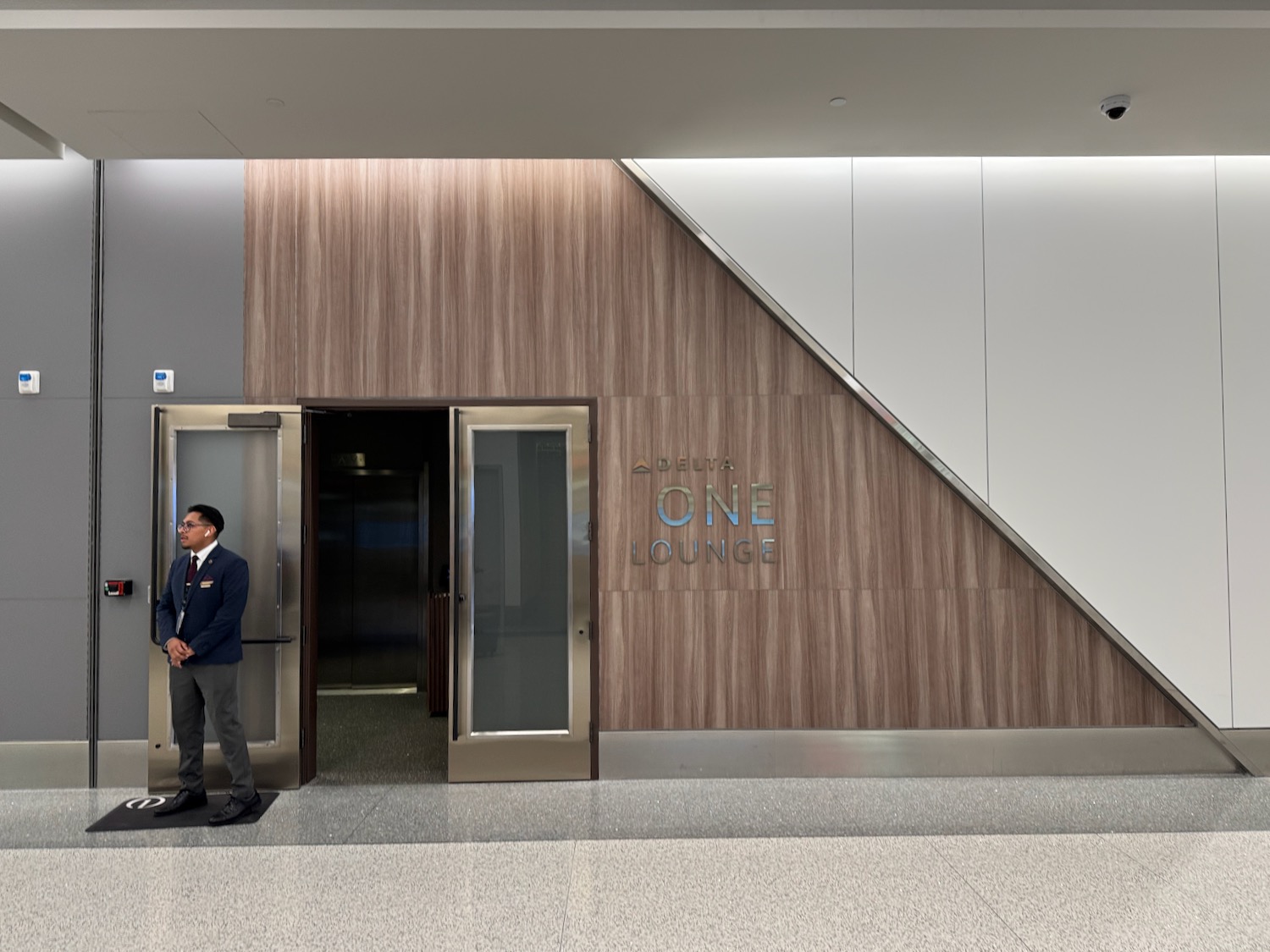 a man standing in front of an elevator