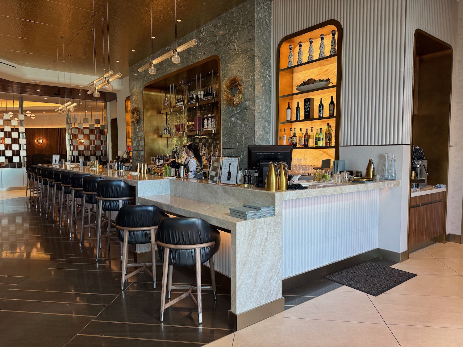 a bar with a counter and stools