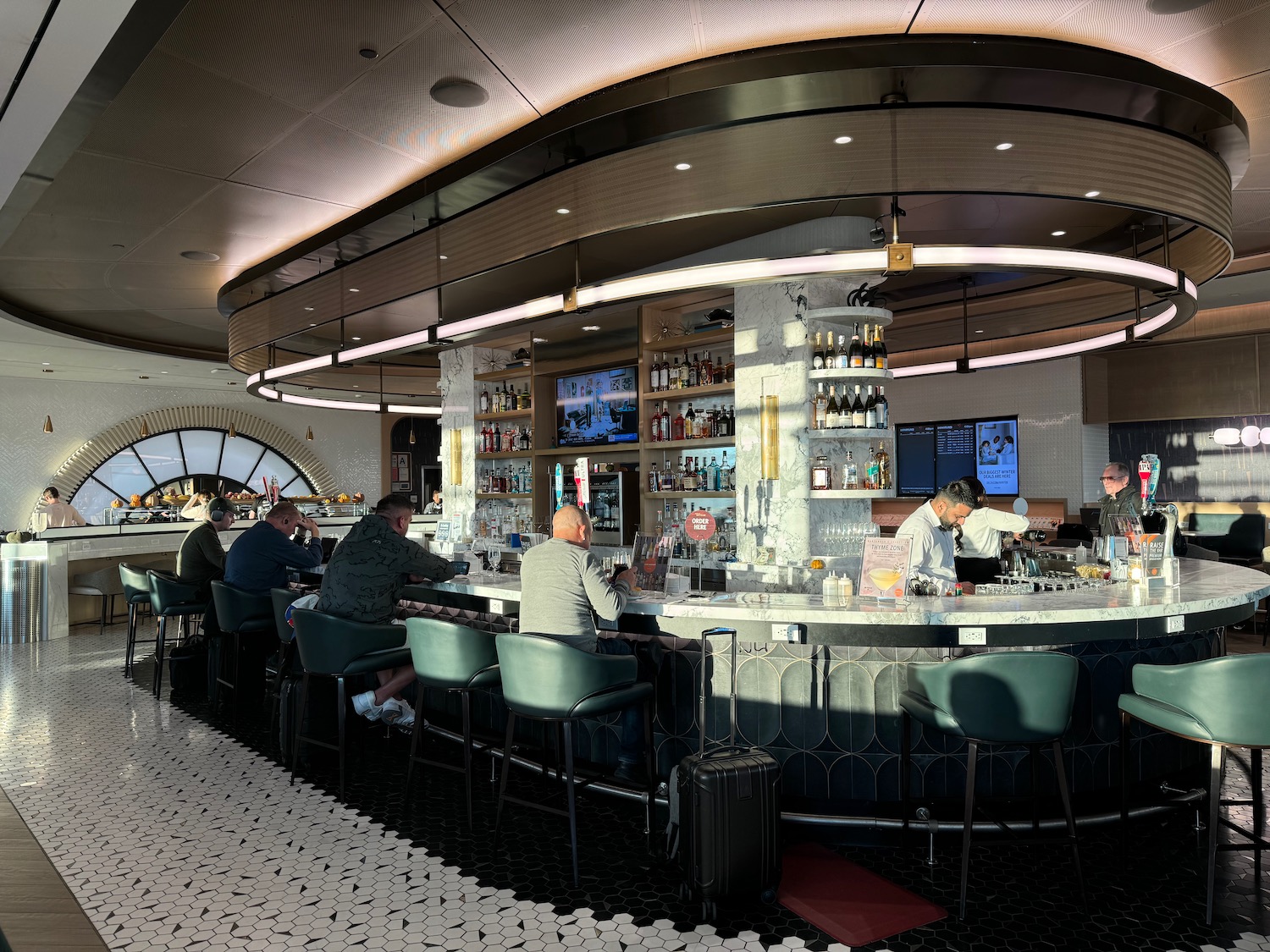 a group of people sitting at a bar