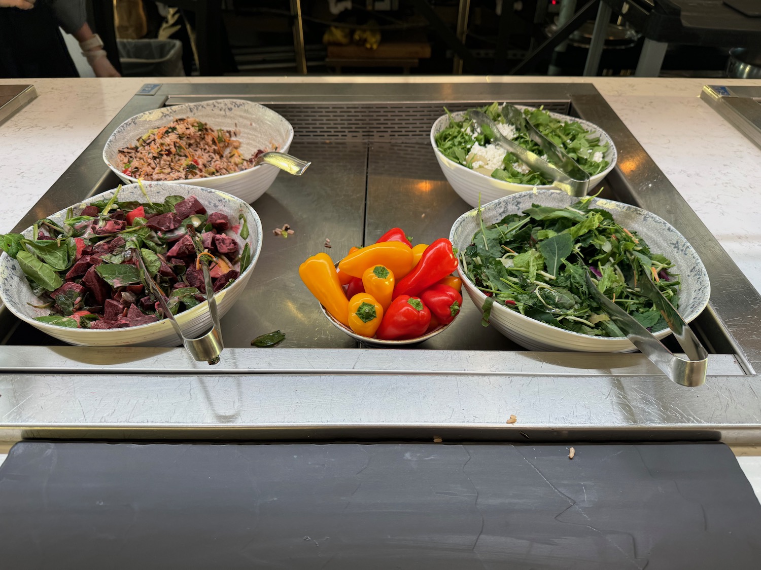 a group of bowls of food on a counter