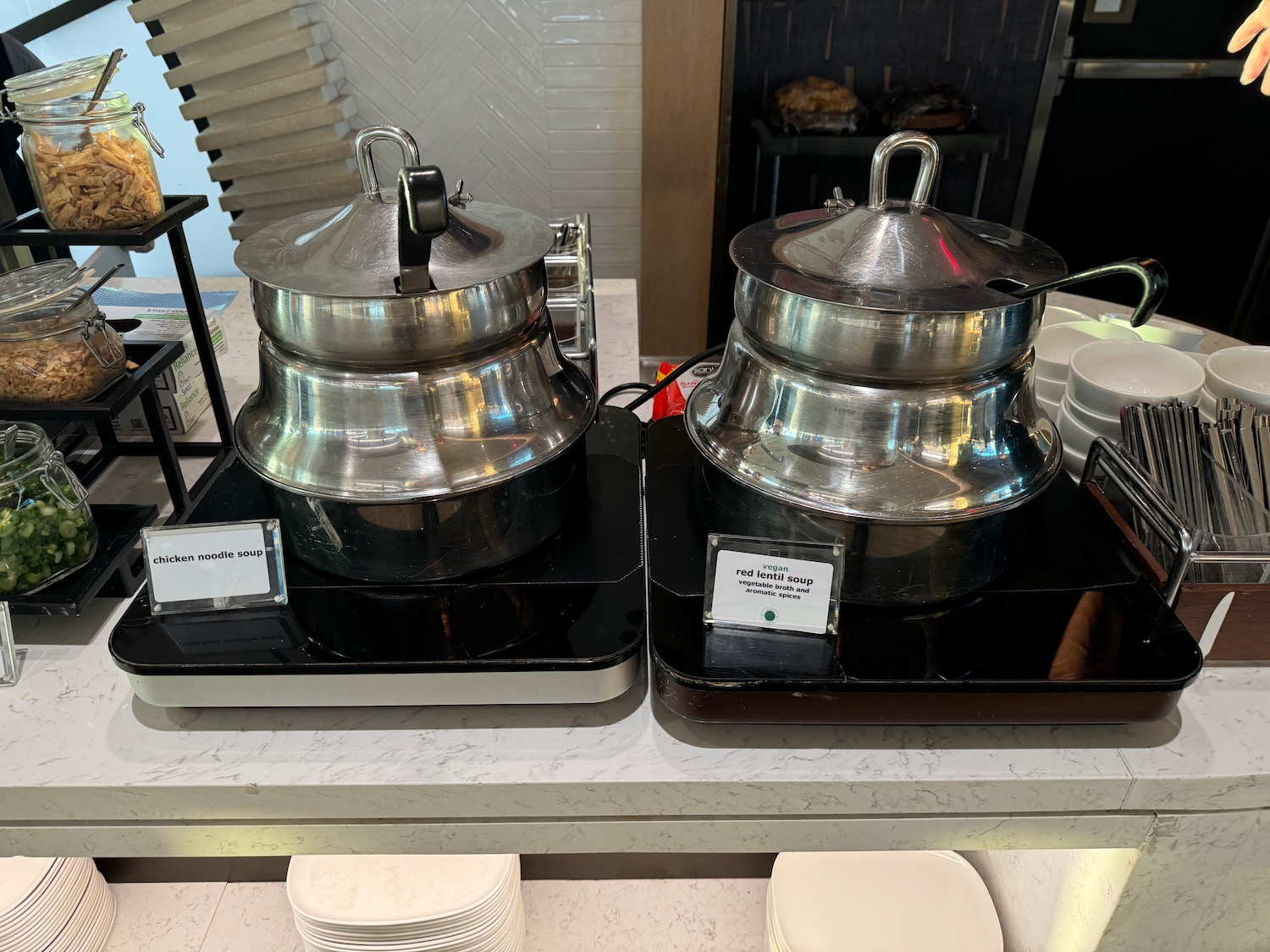 two metal pots on a table