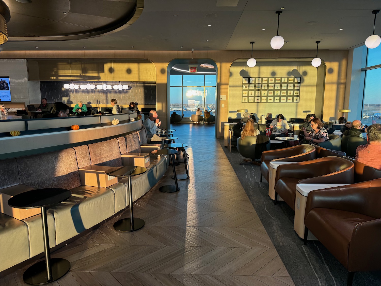 a group of people sitting at tables in a restaurant