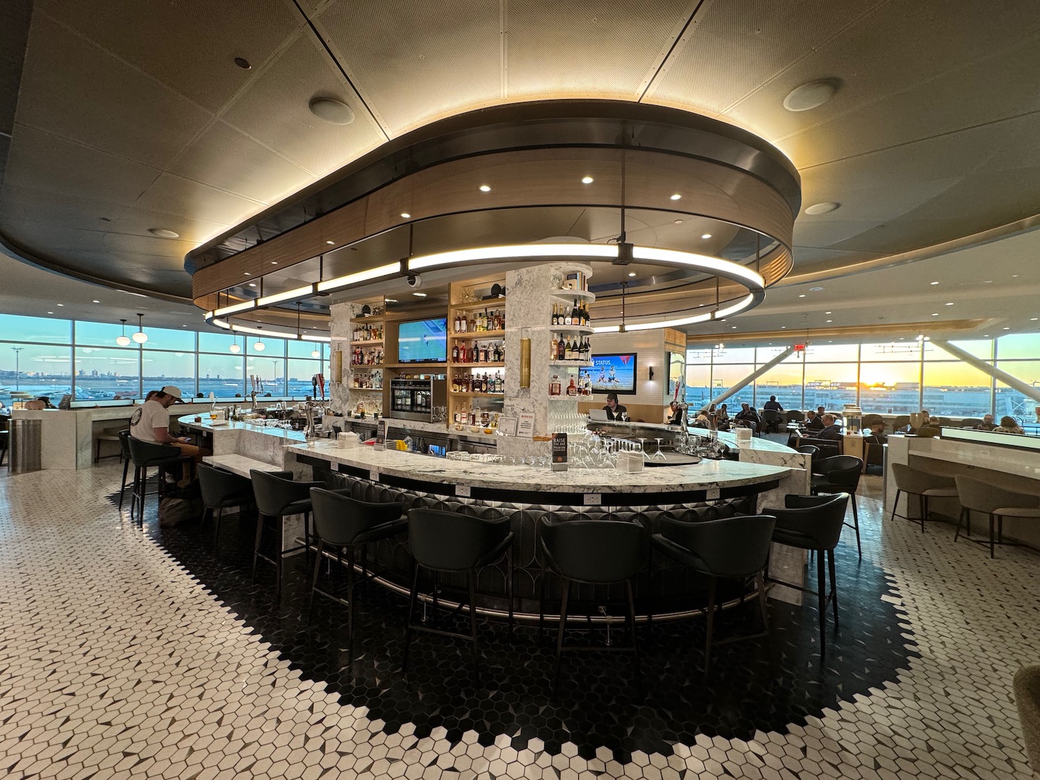 a bar with a counter and chairs