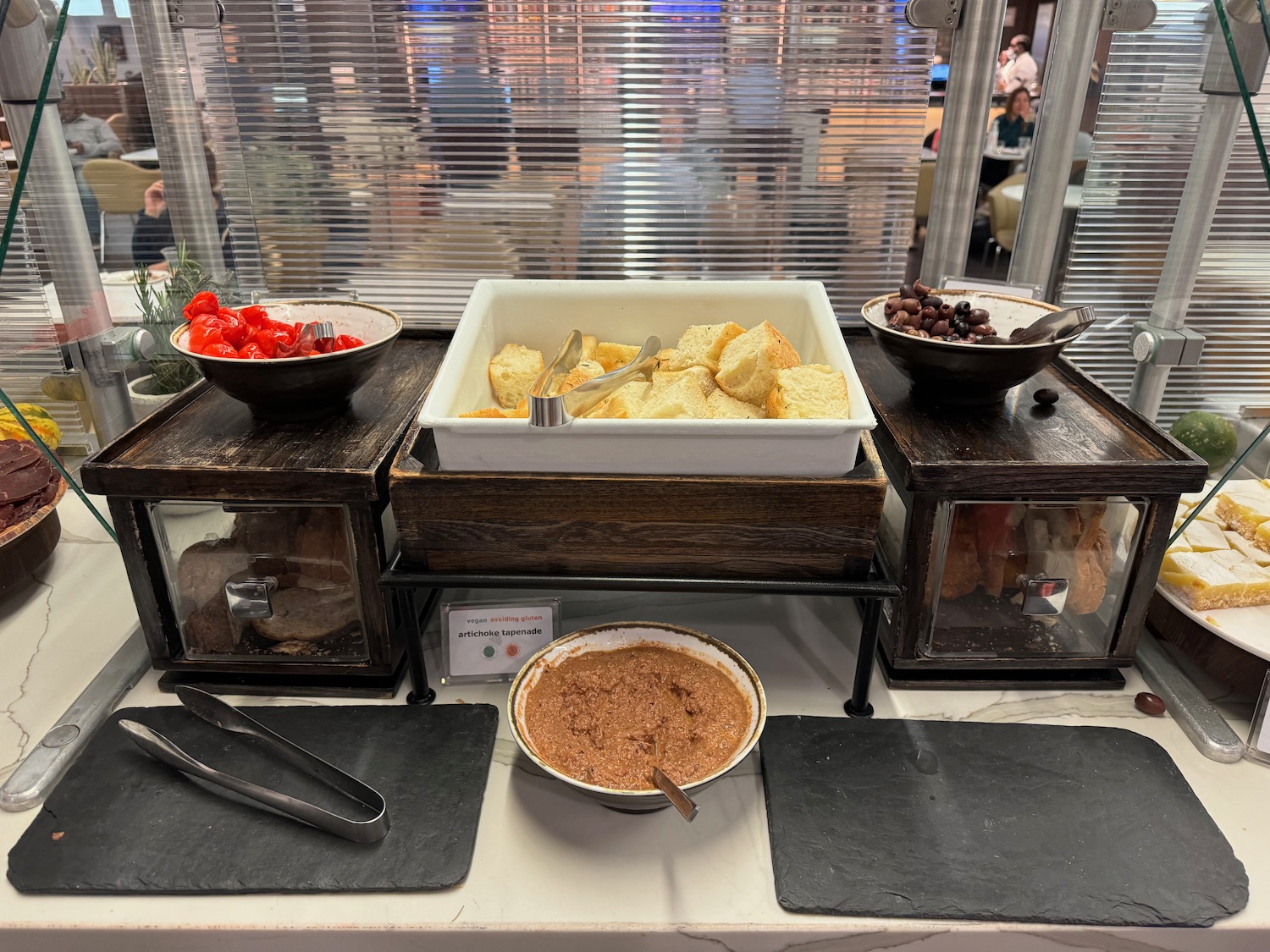 a buffet table with food in bowls