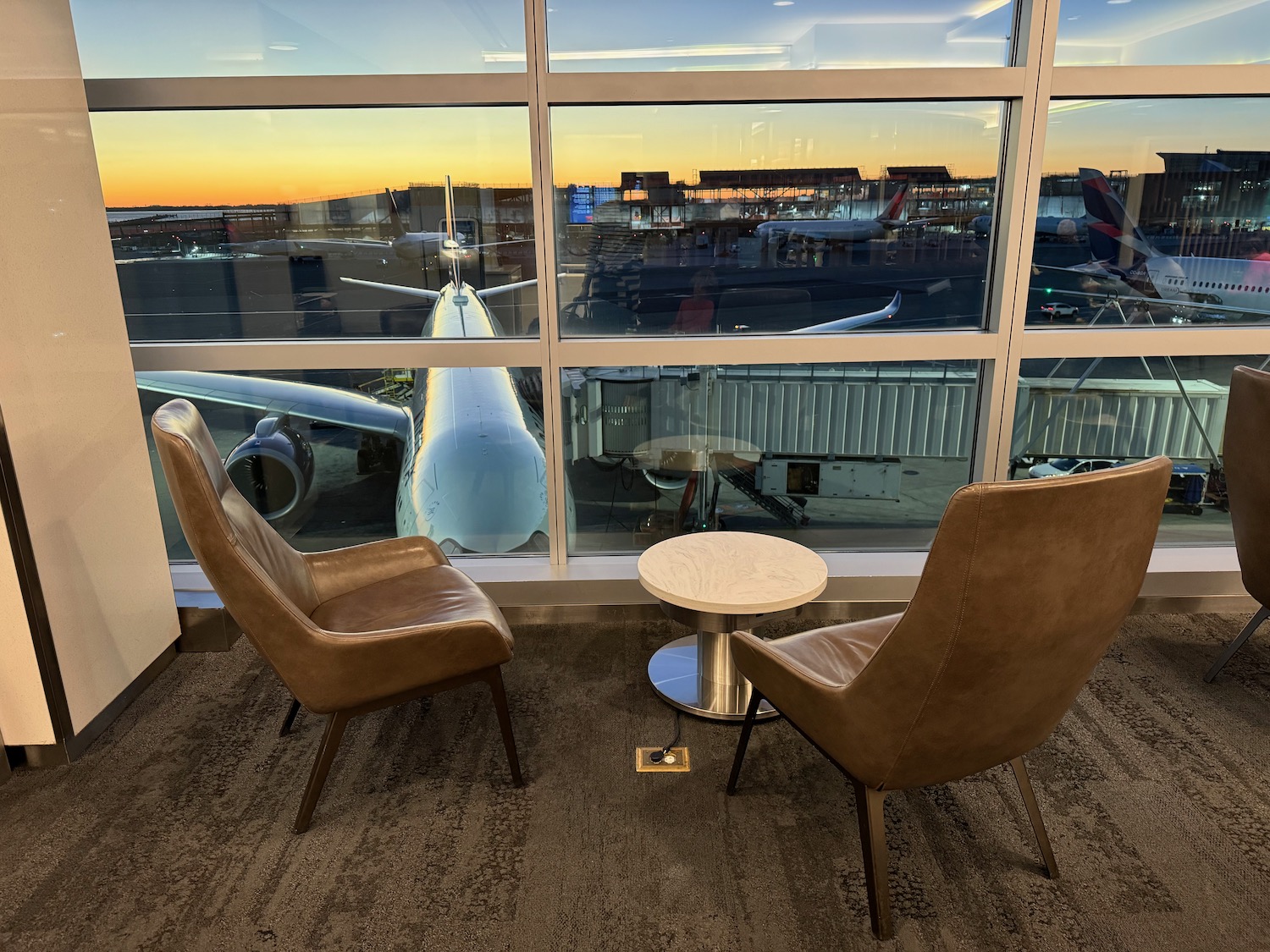 two chairs and a table in front of a window