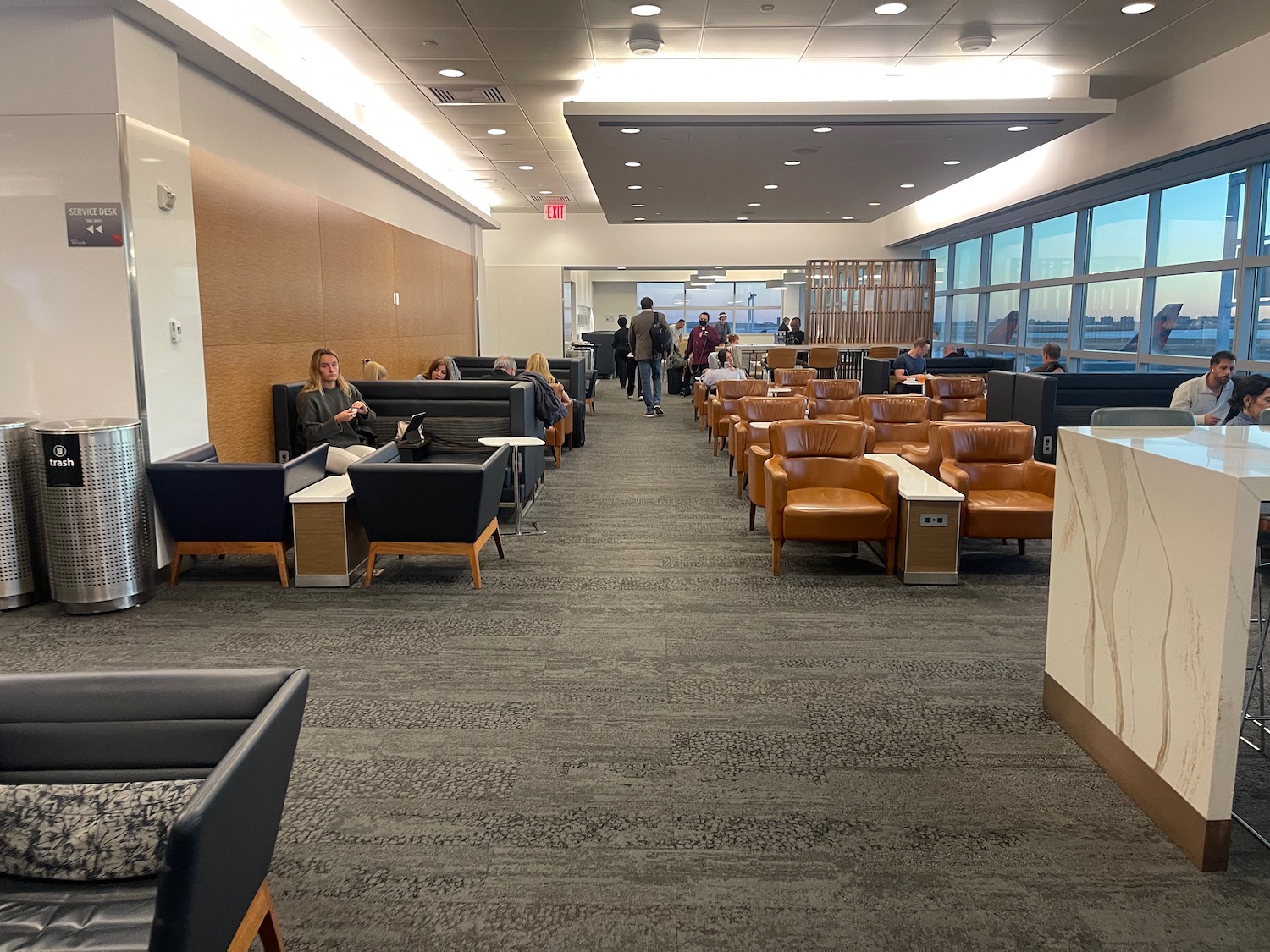 a group of people sitting in a lounge area