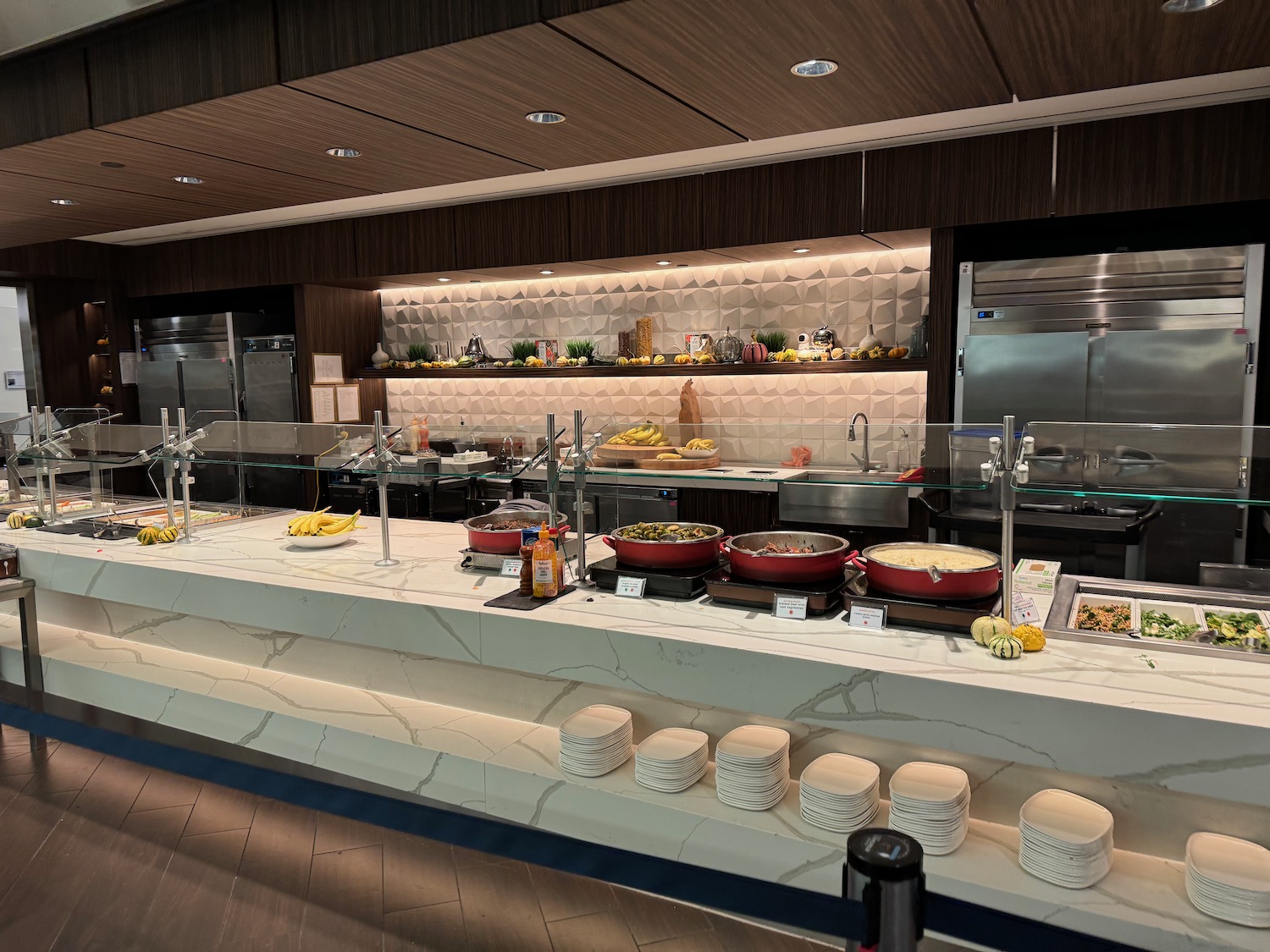 a buffet line with food on the counter