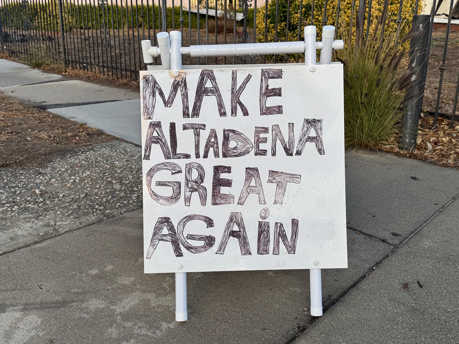 a sign on the sidewalk