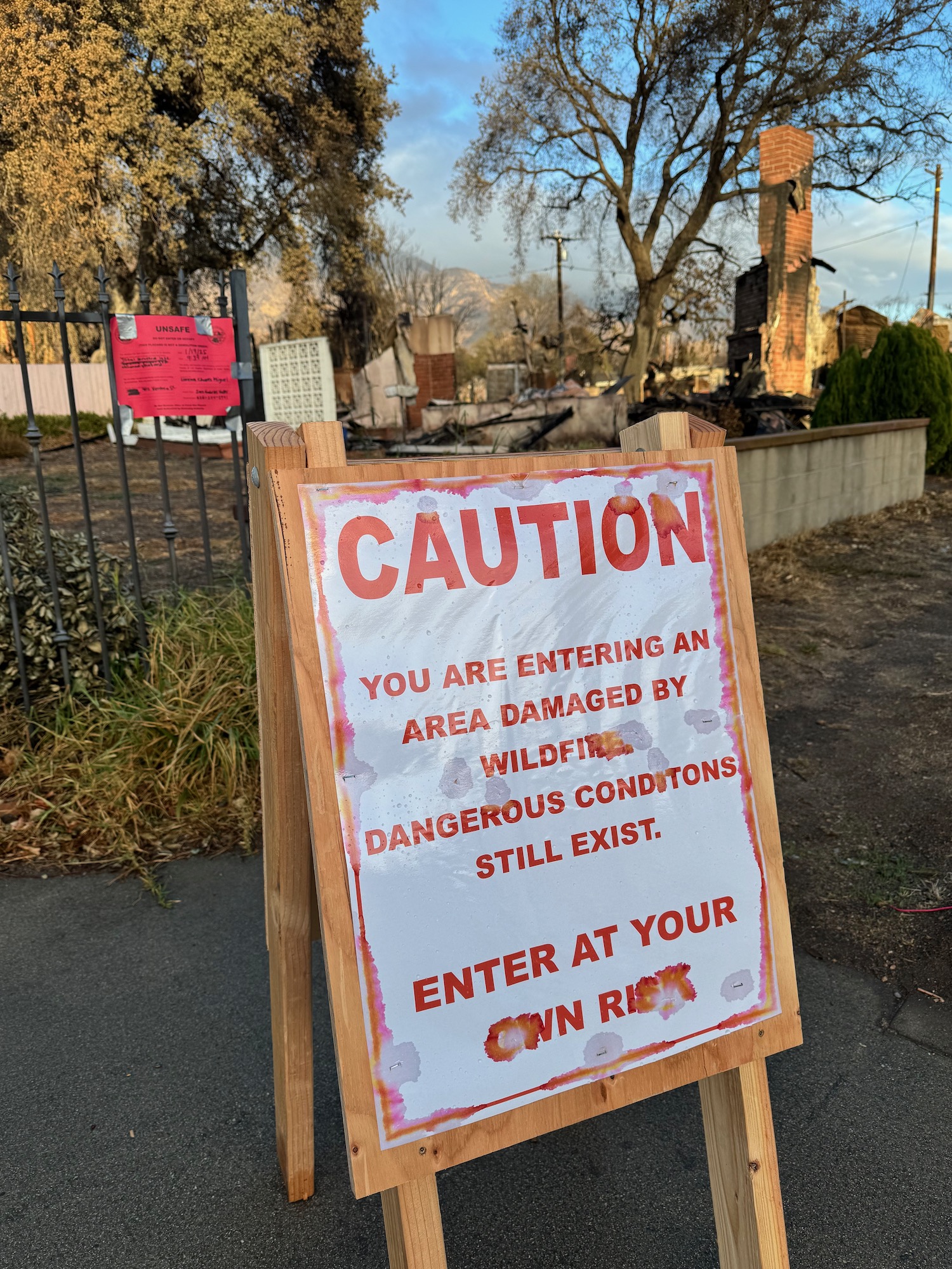 a sign on a sidewalk