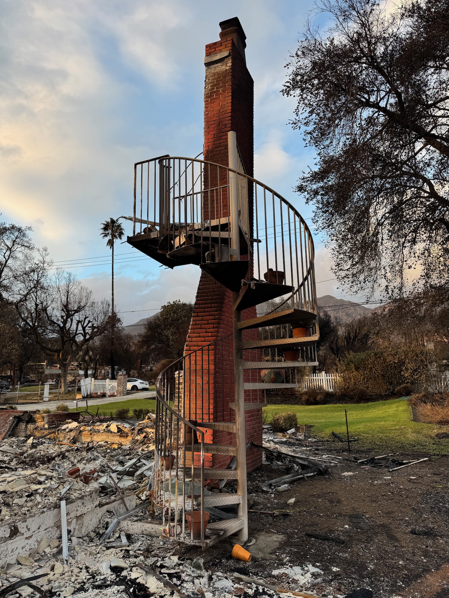 a spiral staircase outside of a brick chimney