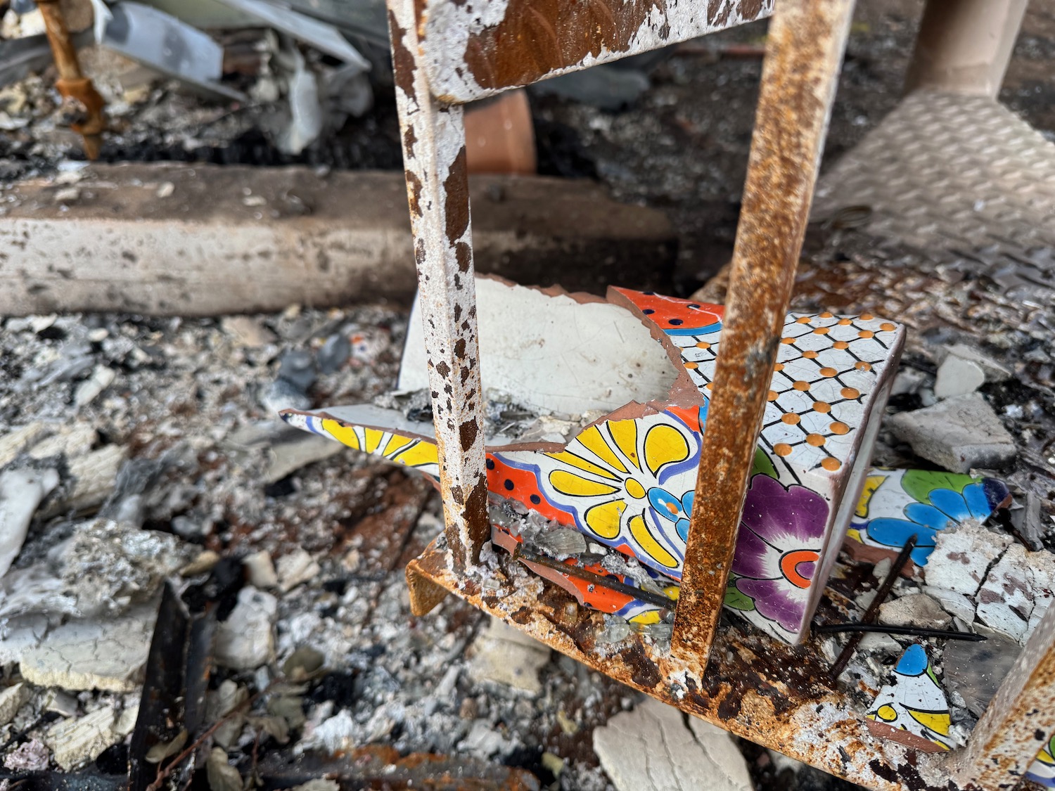 broken tile on a metal railing