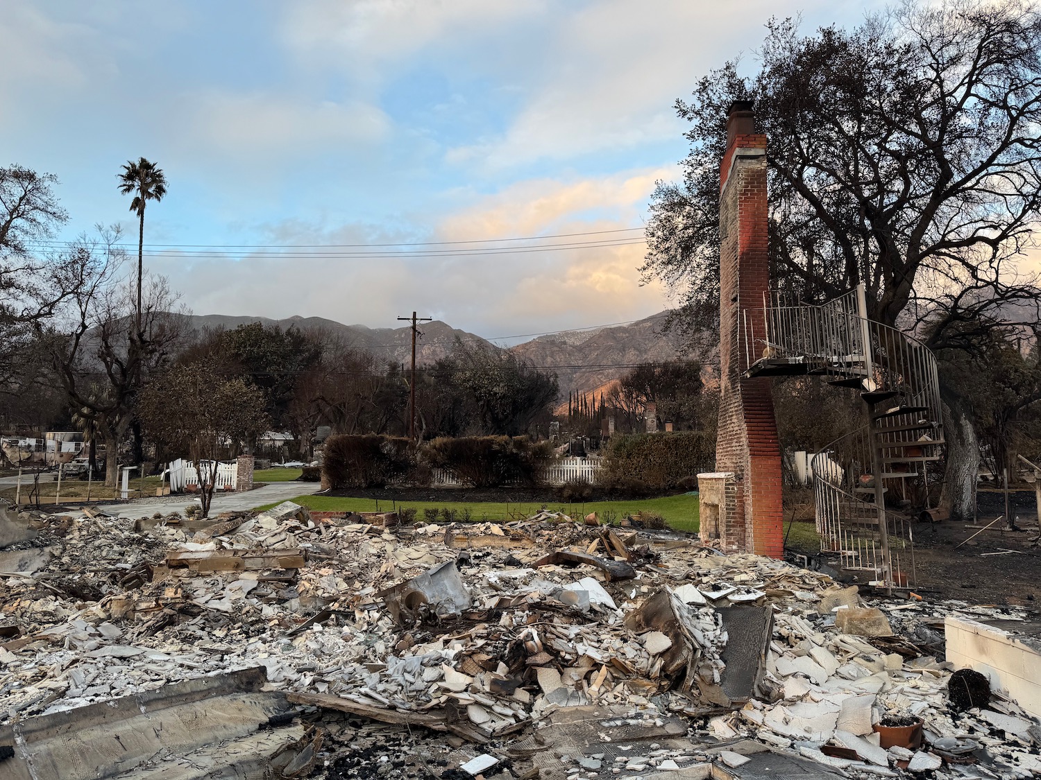 a destroyed house with a pile of debris