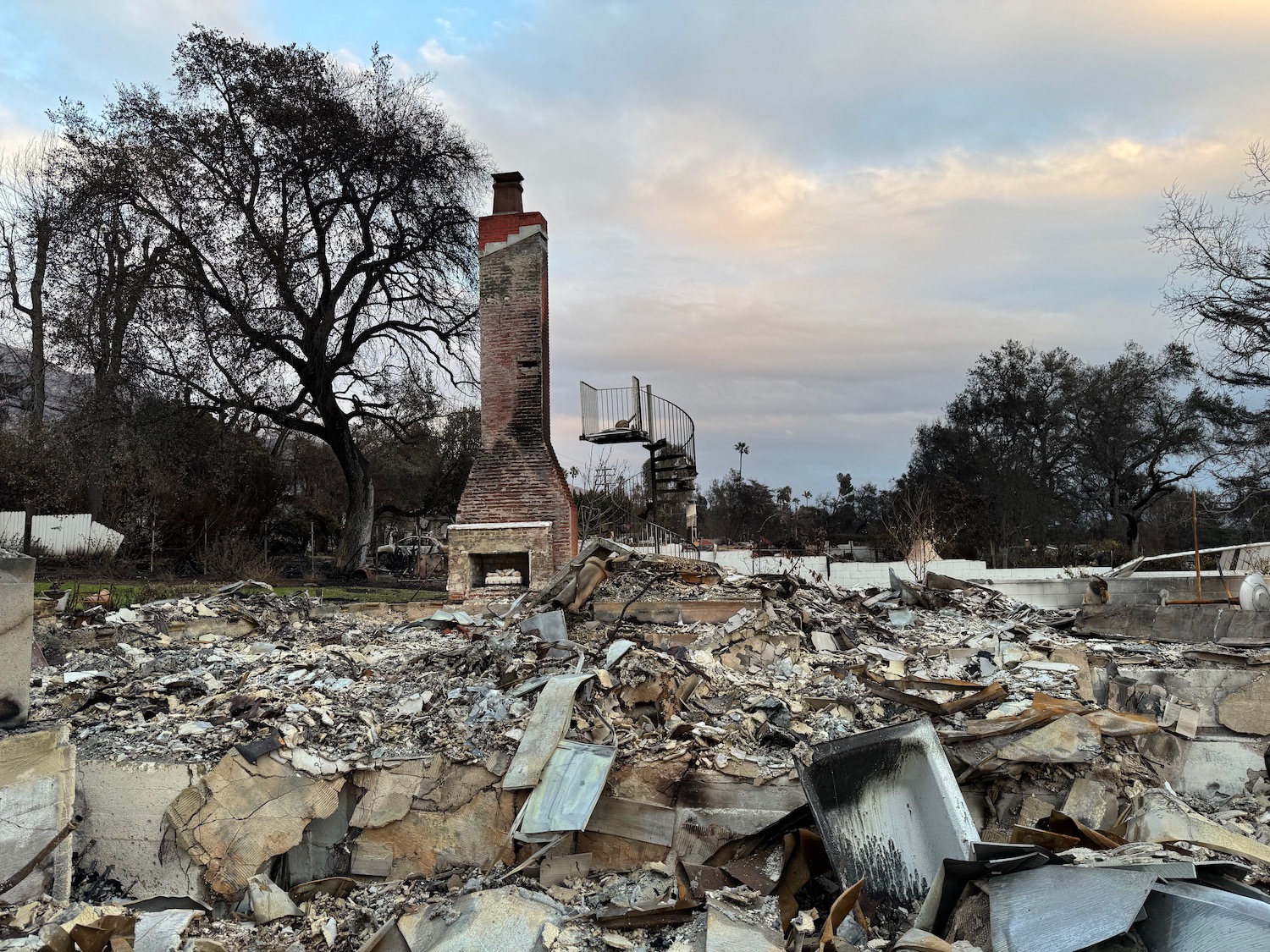 a pile of rubble and a brick chimney