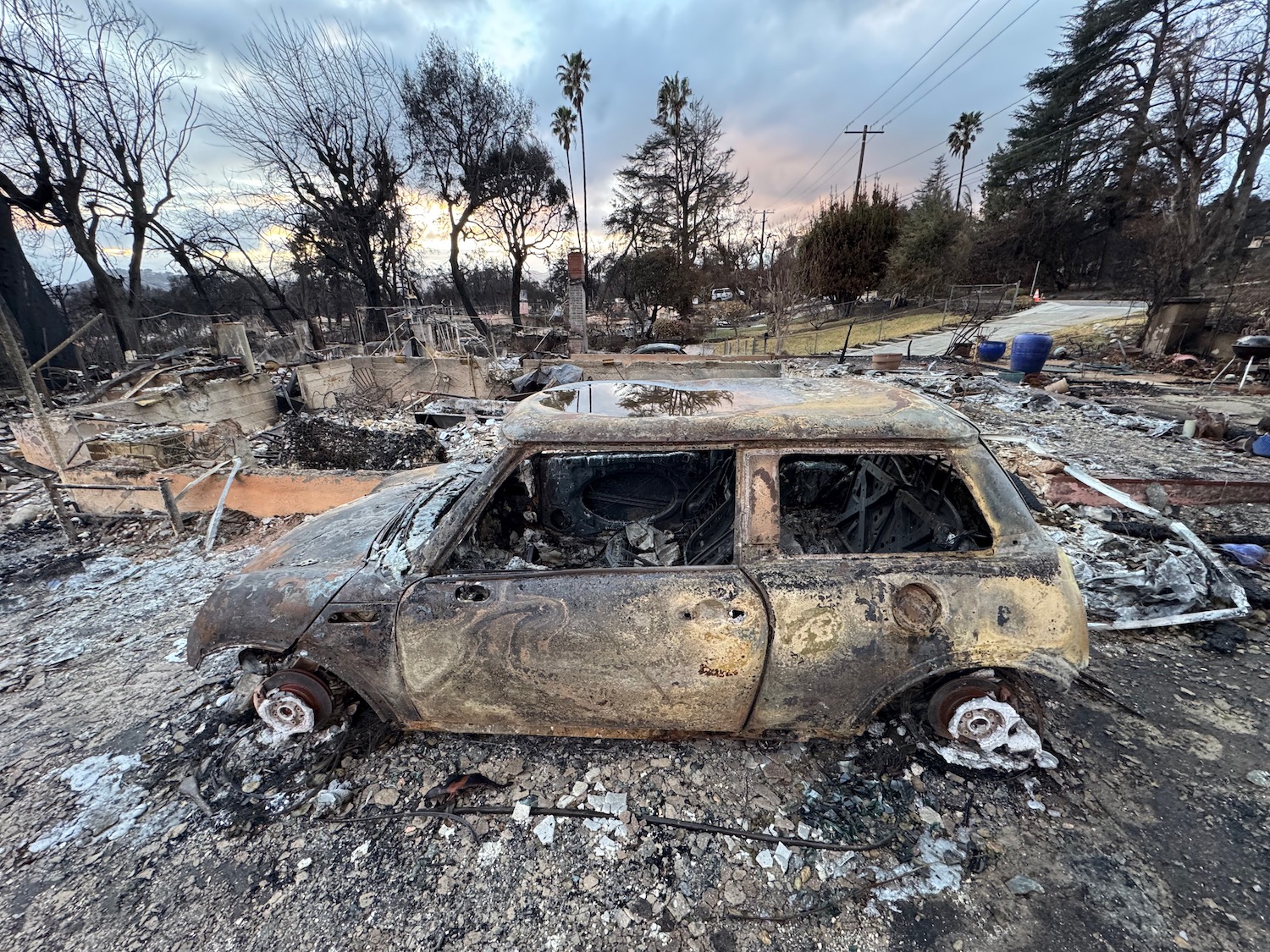 a burnt out car in a burned out area